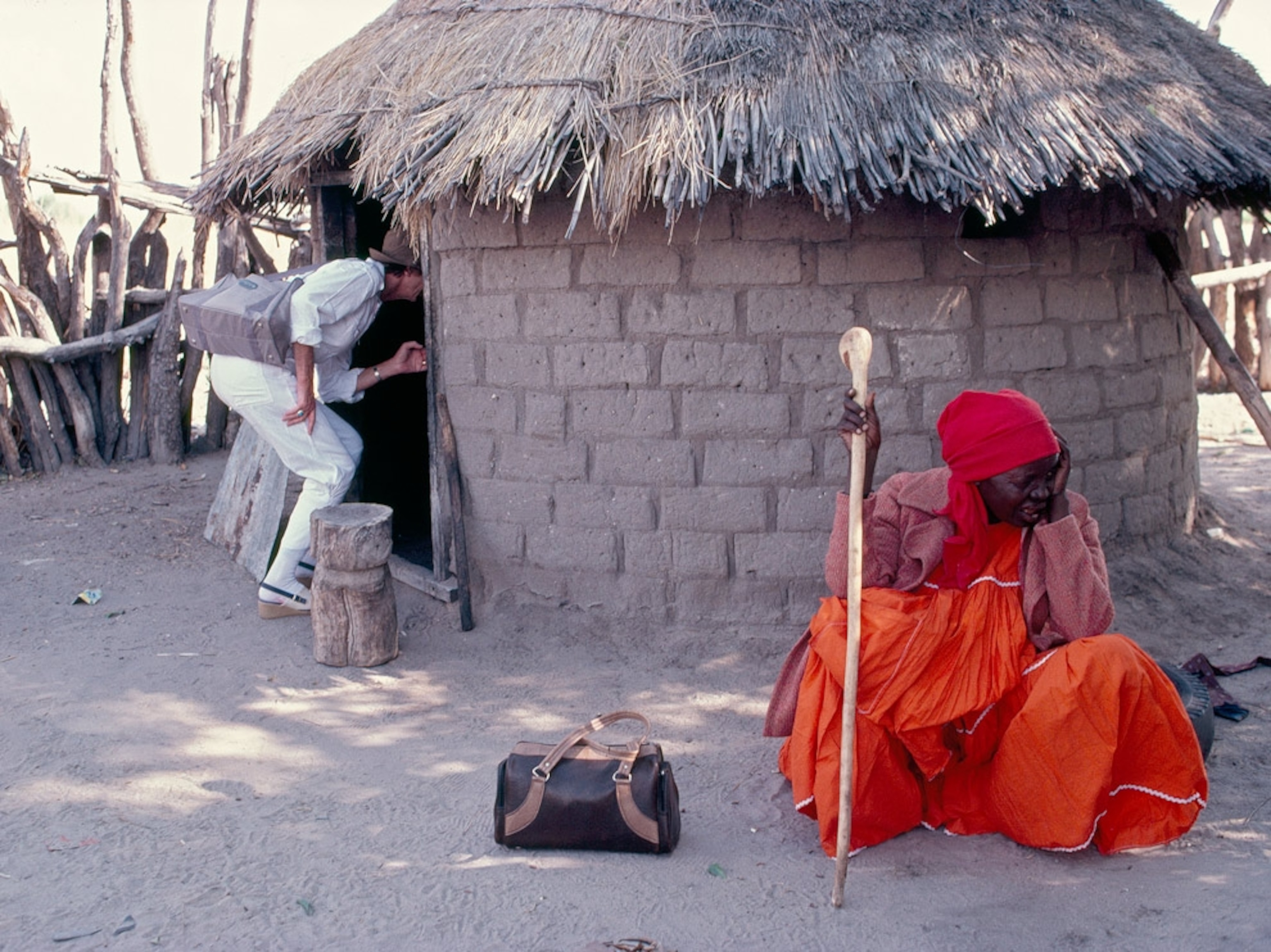 Doctor inspecting a hut in Namibia
