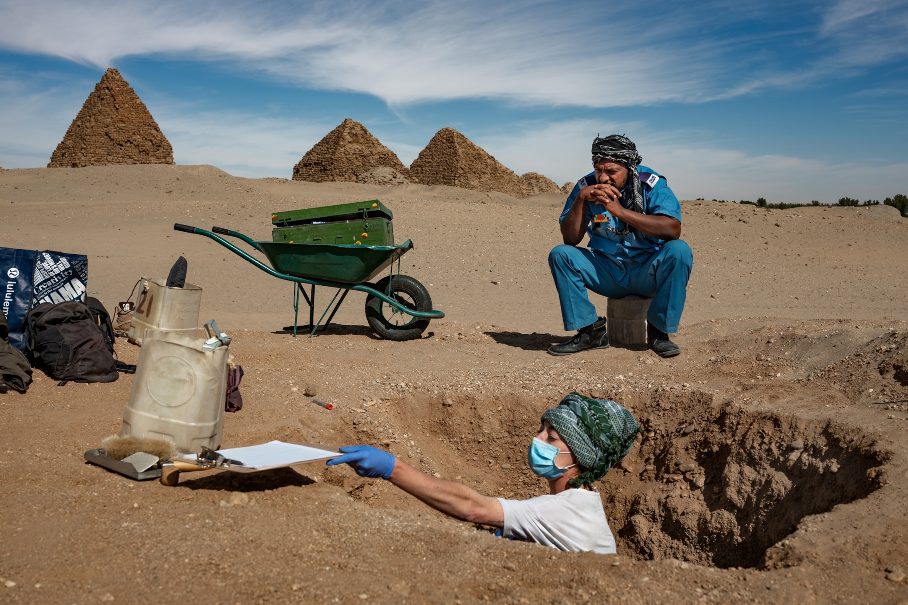 Picture of police officer watching the excavation.