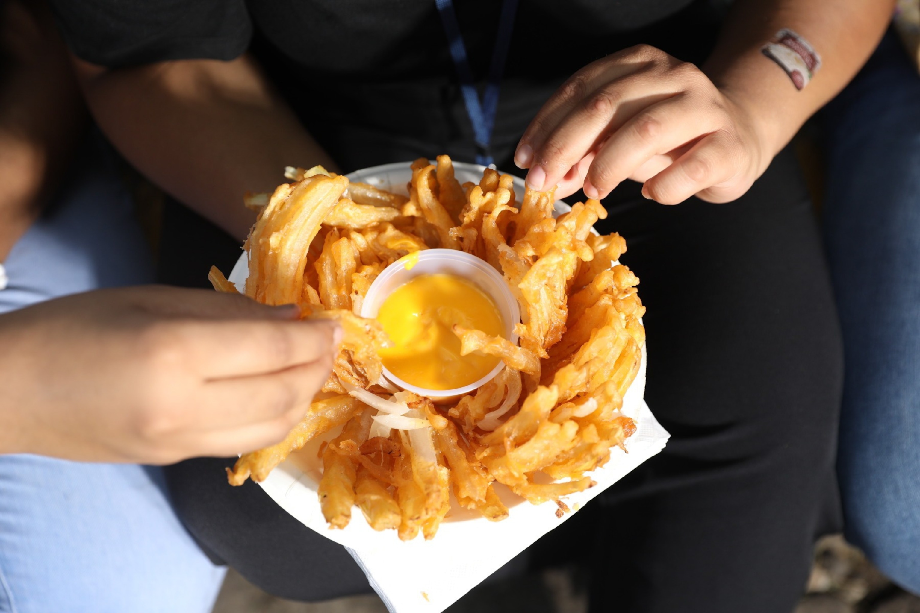 Friends share a fried blooming onion.