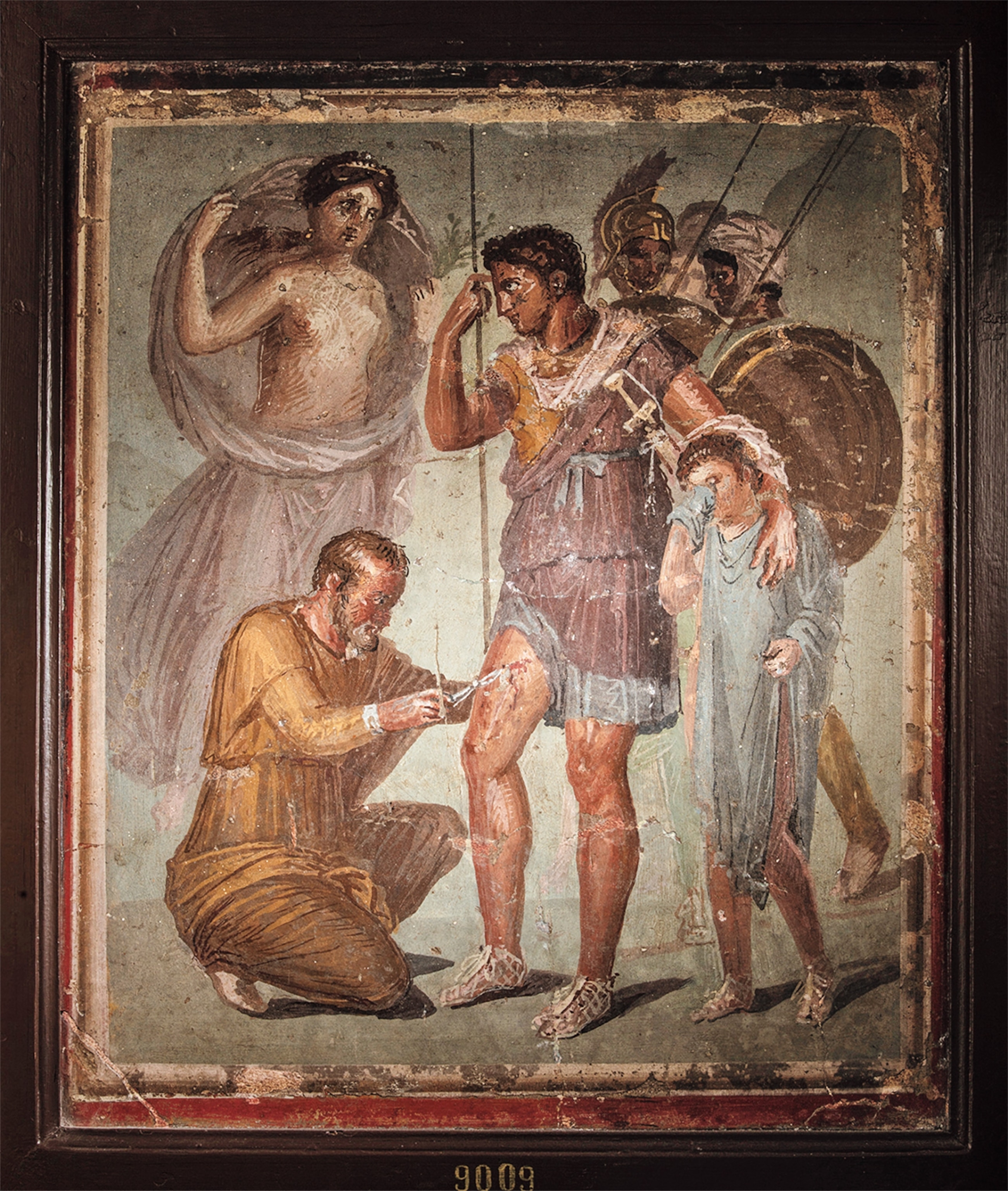 Ancient medics—here, a doctor removes an arrowhead from an injured hero—often learned their trade at gladiator schools.