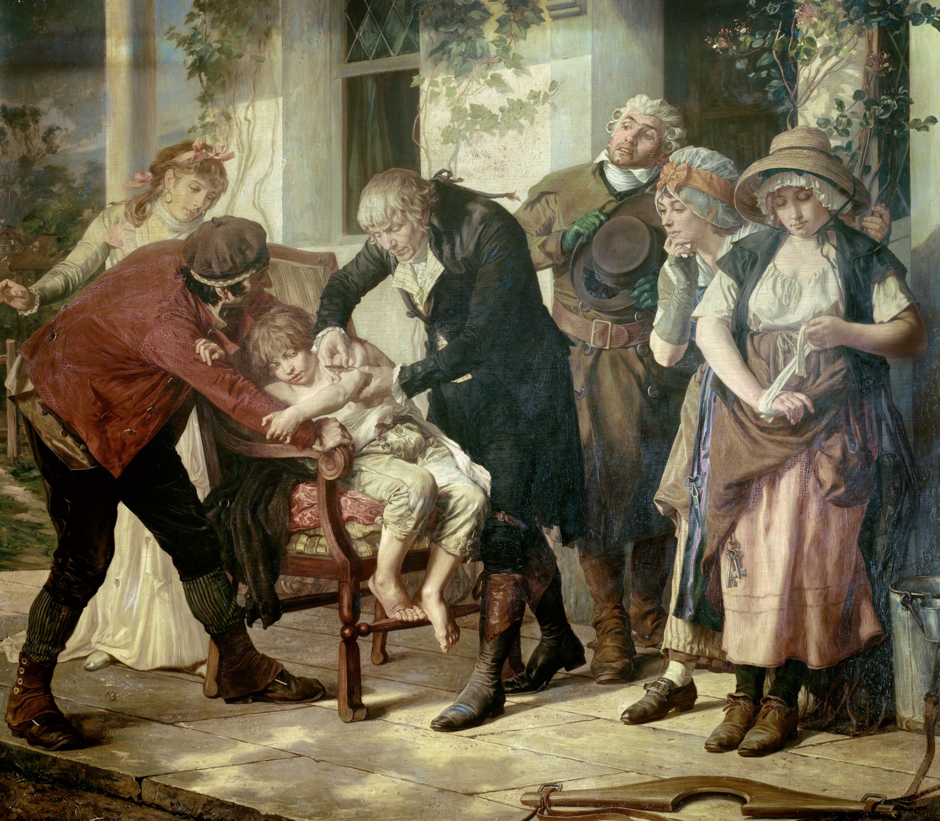 Picture of a painted scene of Edward Jenner administering the first Smallpox vaccine to eight-year-old James Philips.