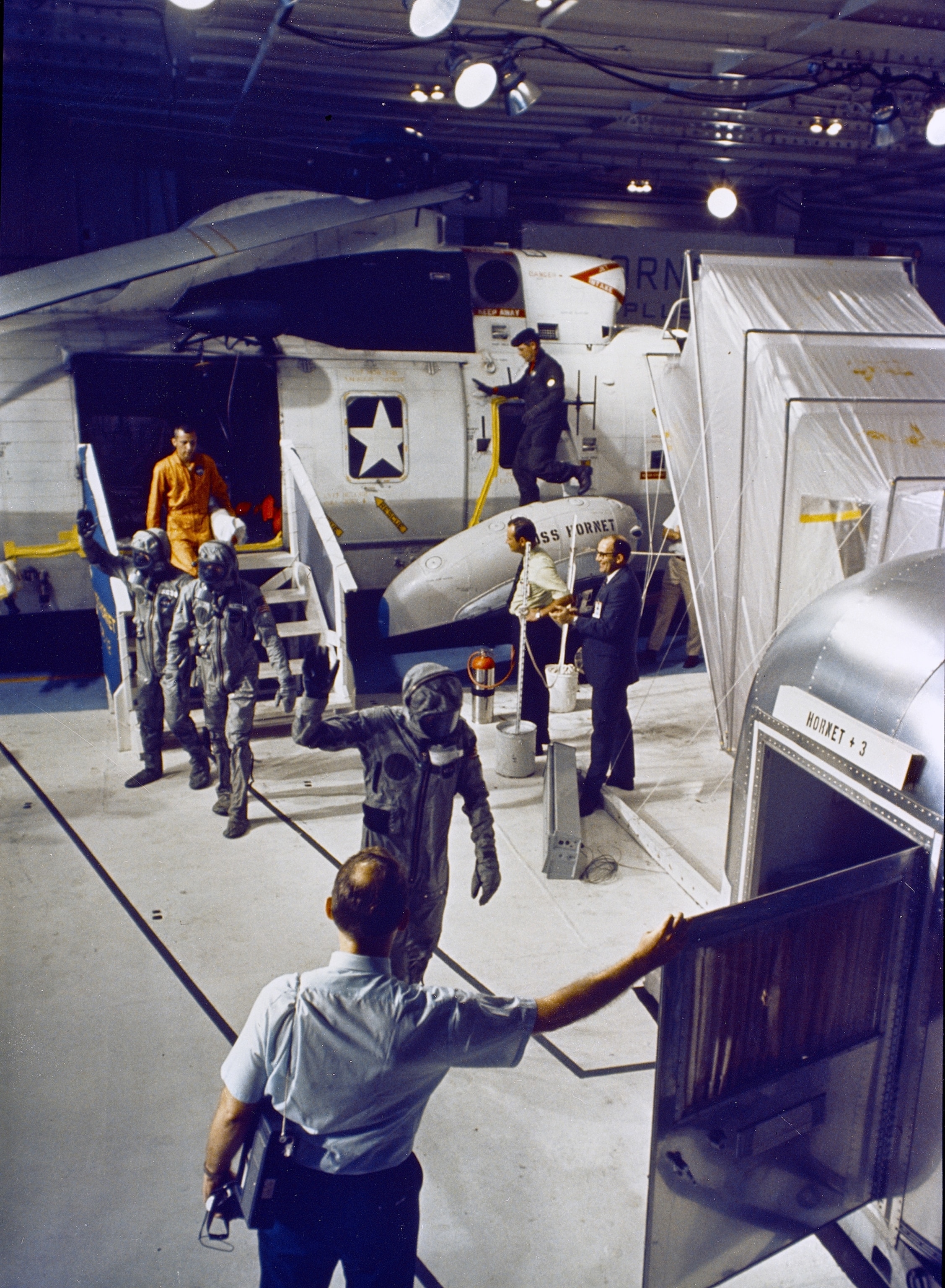 astronauts going into a trailer