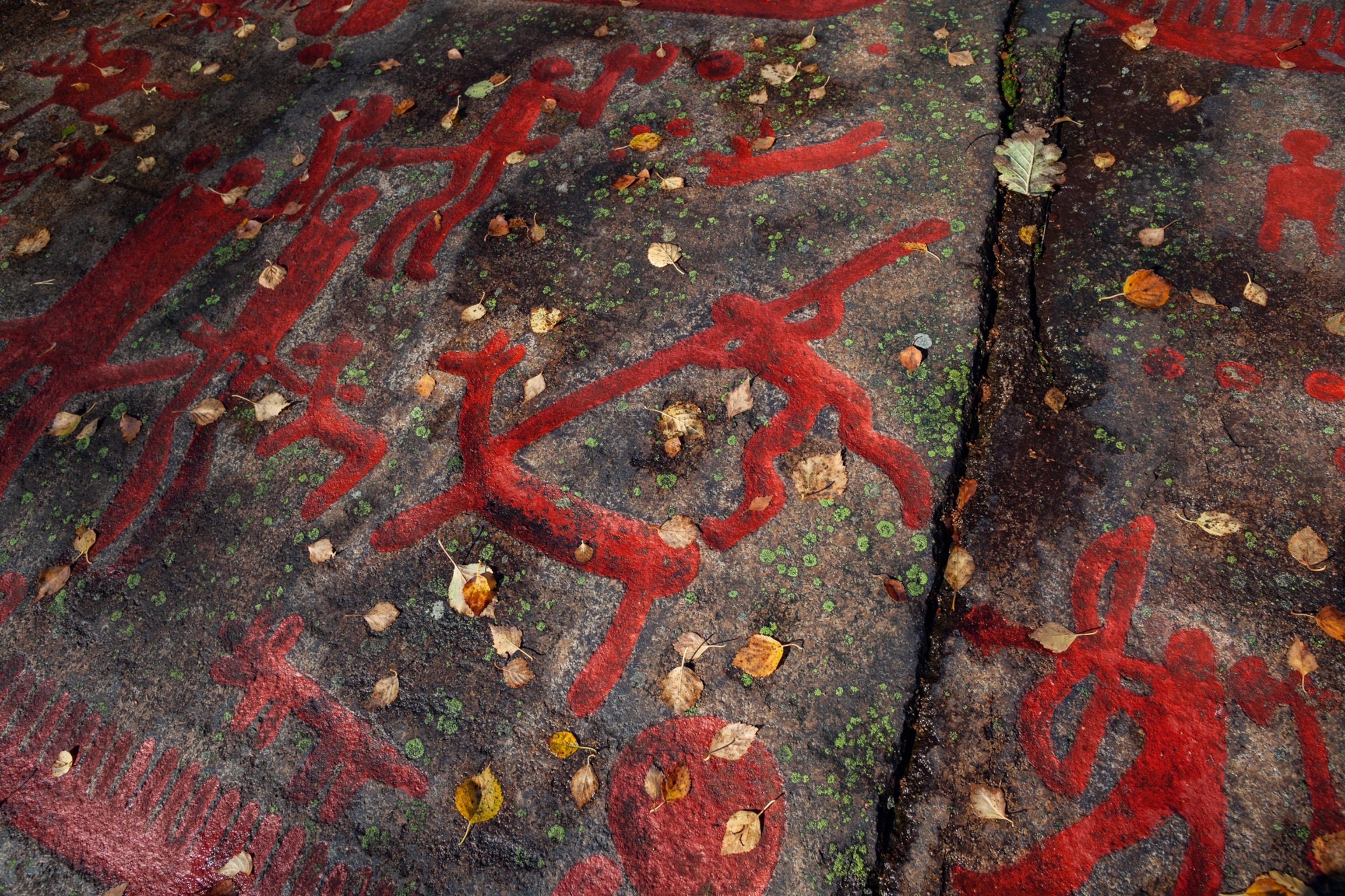 red symbols on grey rock