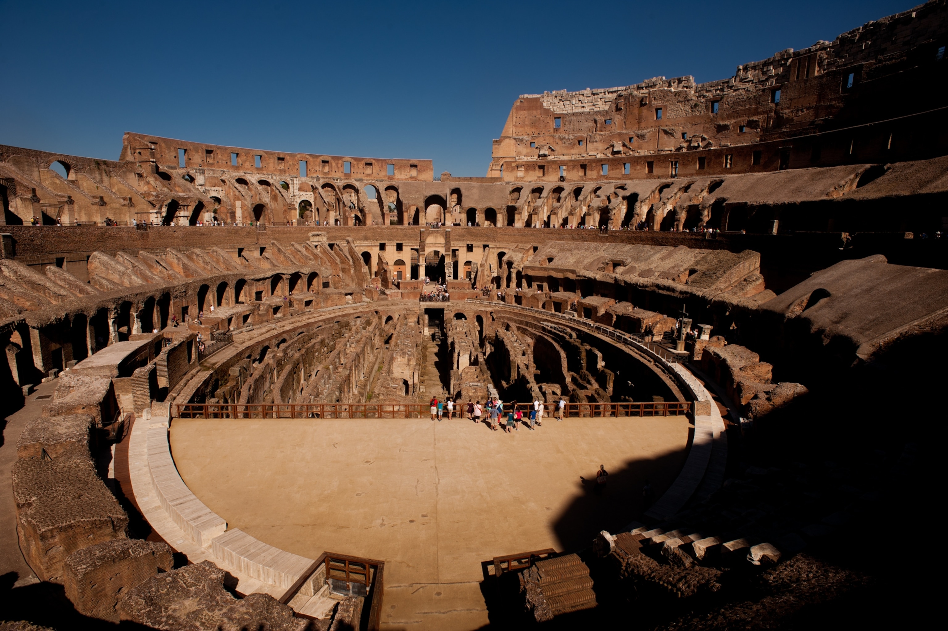 Inside the colosseum from above you can see people exploring.