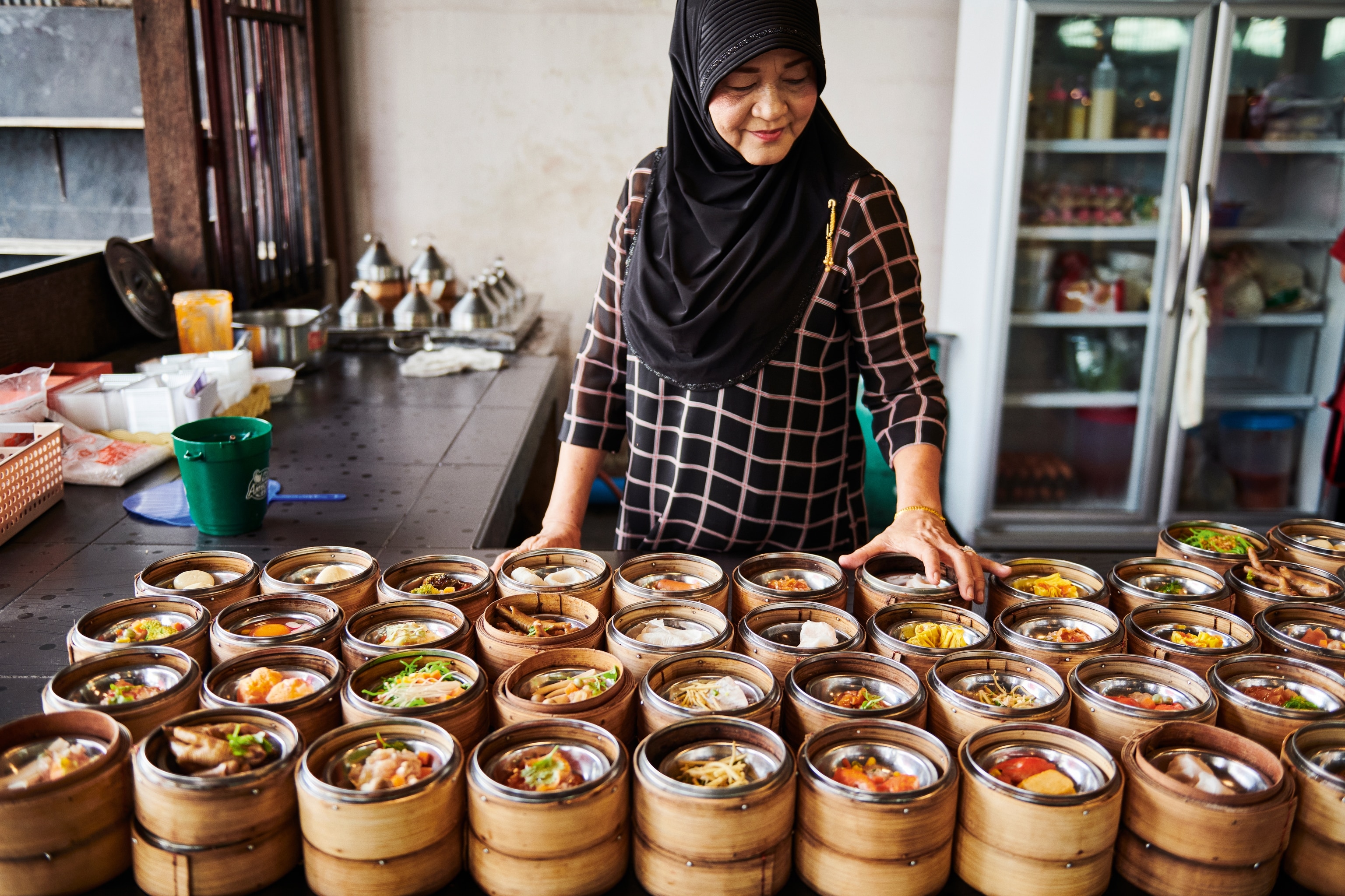 woman selling dim sum in thailand
