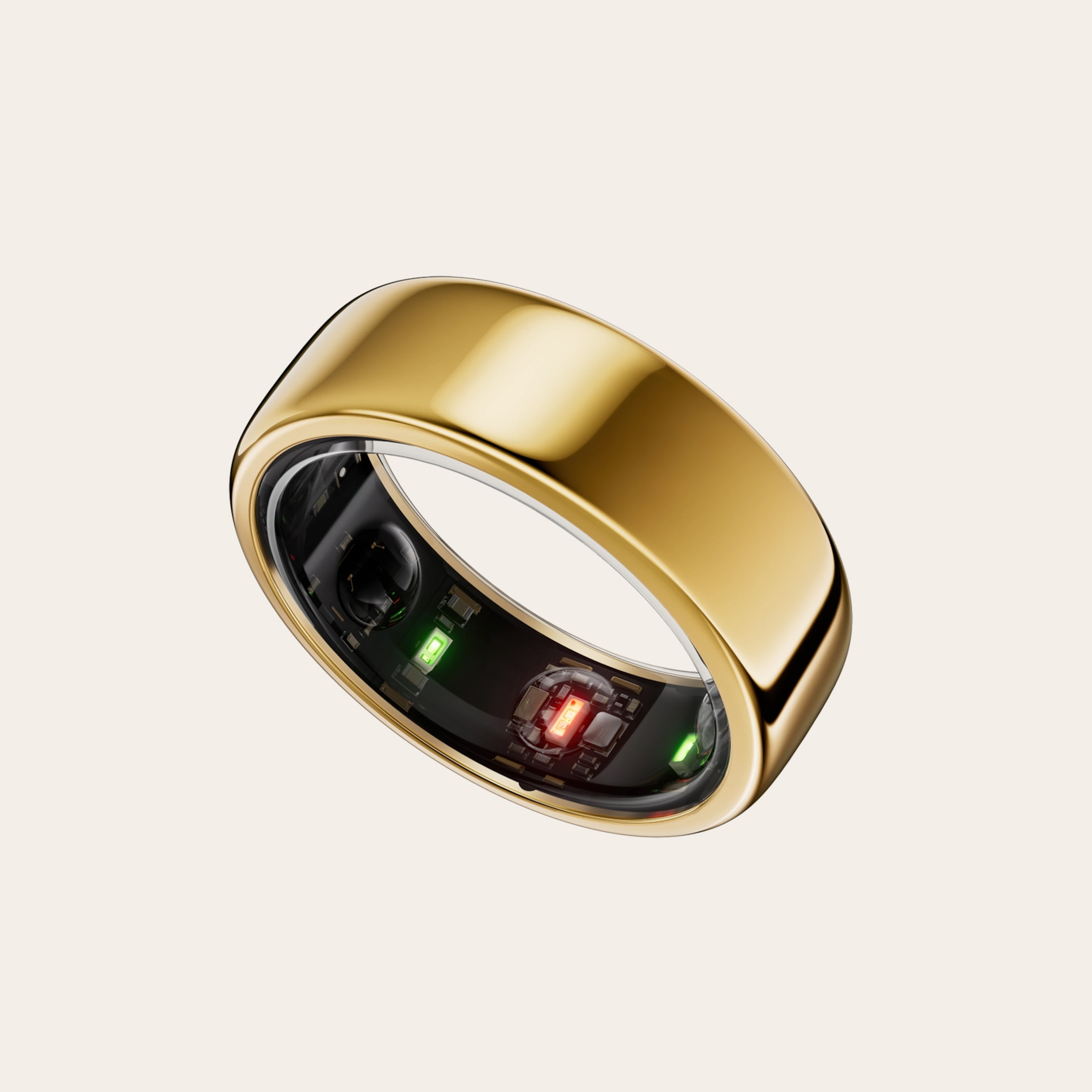 A gold ring with electronic monitoring visible along the inner surface.