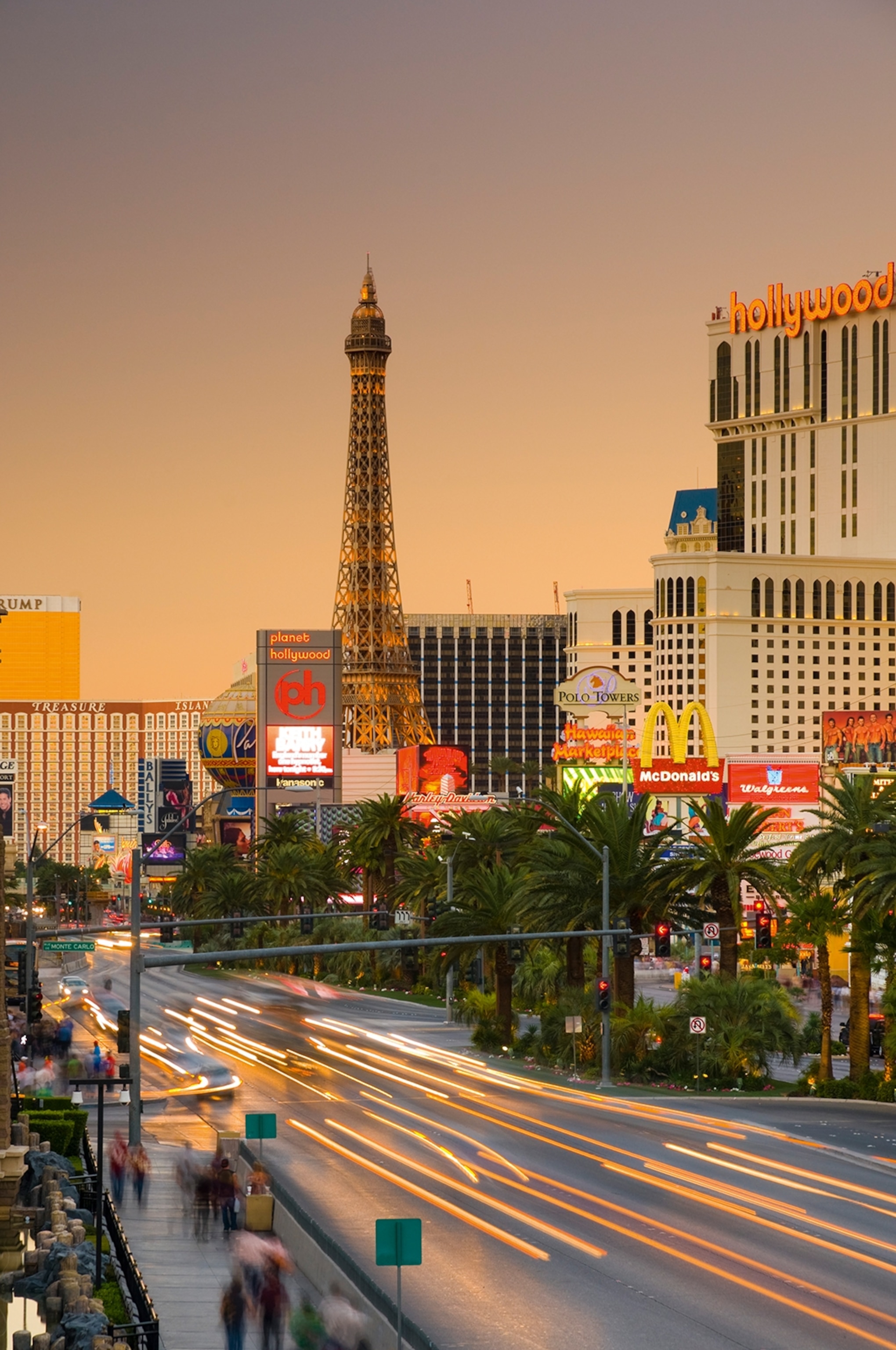 A time-lapsed shot of the busy Las Vegas strip including McDonalds, hotels, casinos and a fake Eiffel Tower.
