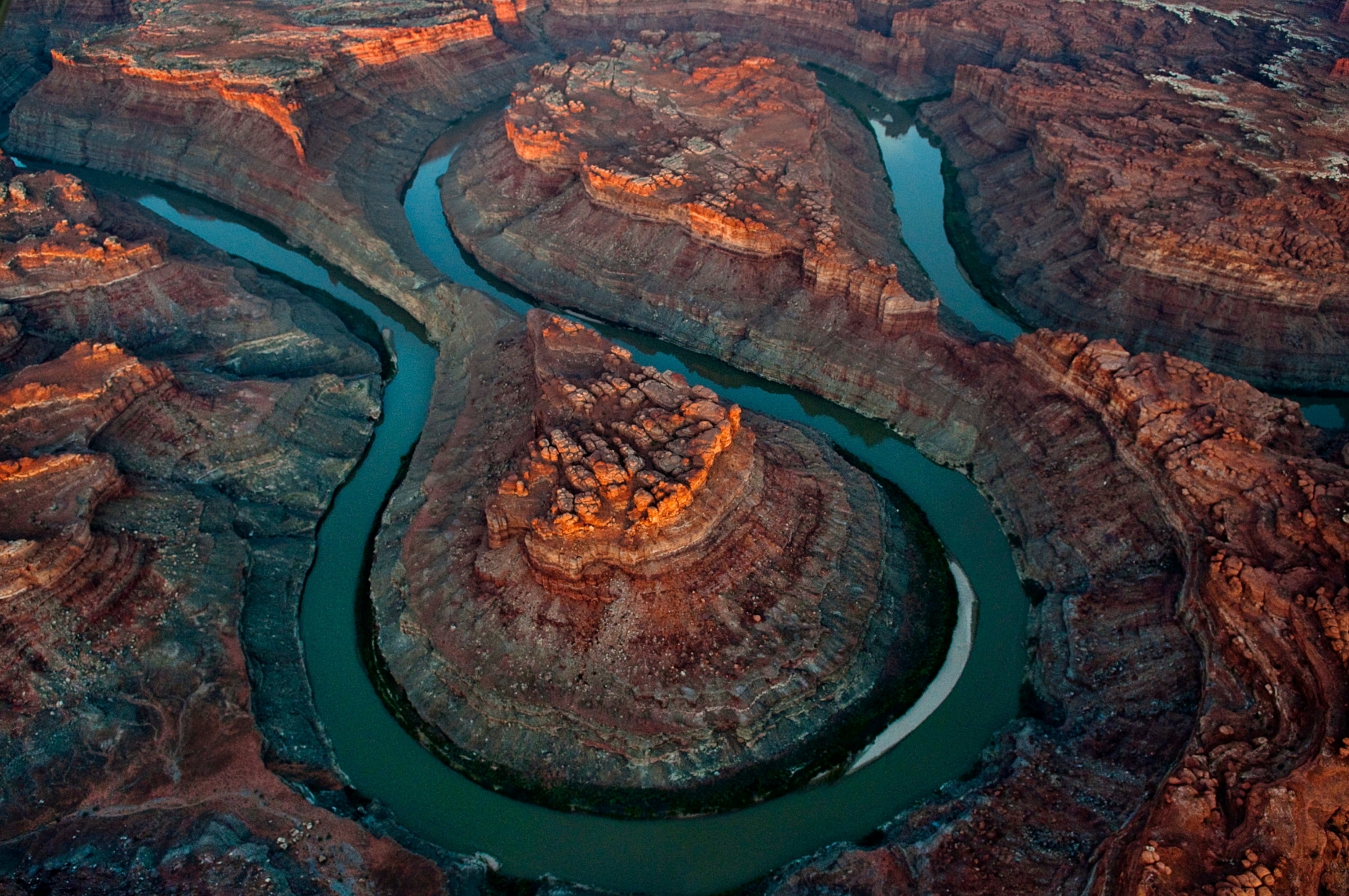Aerial view of river flowing throw canyon in the evening