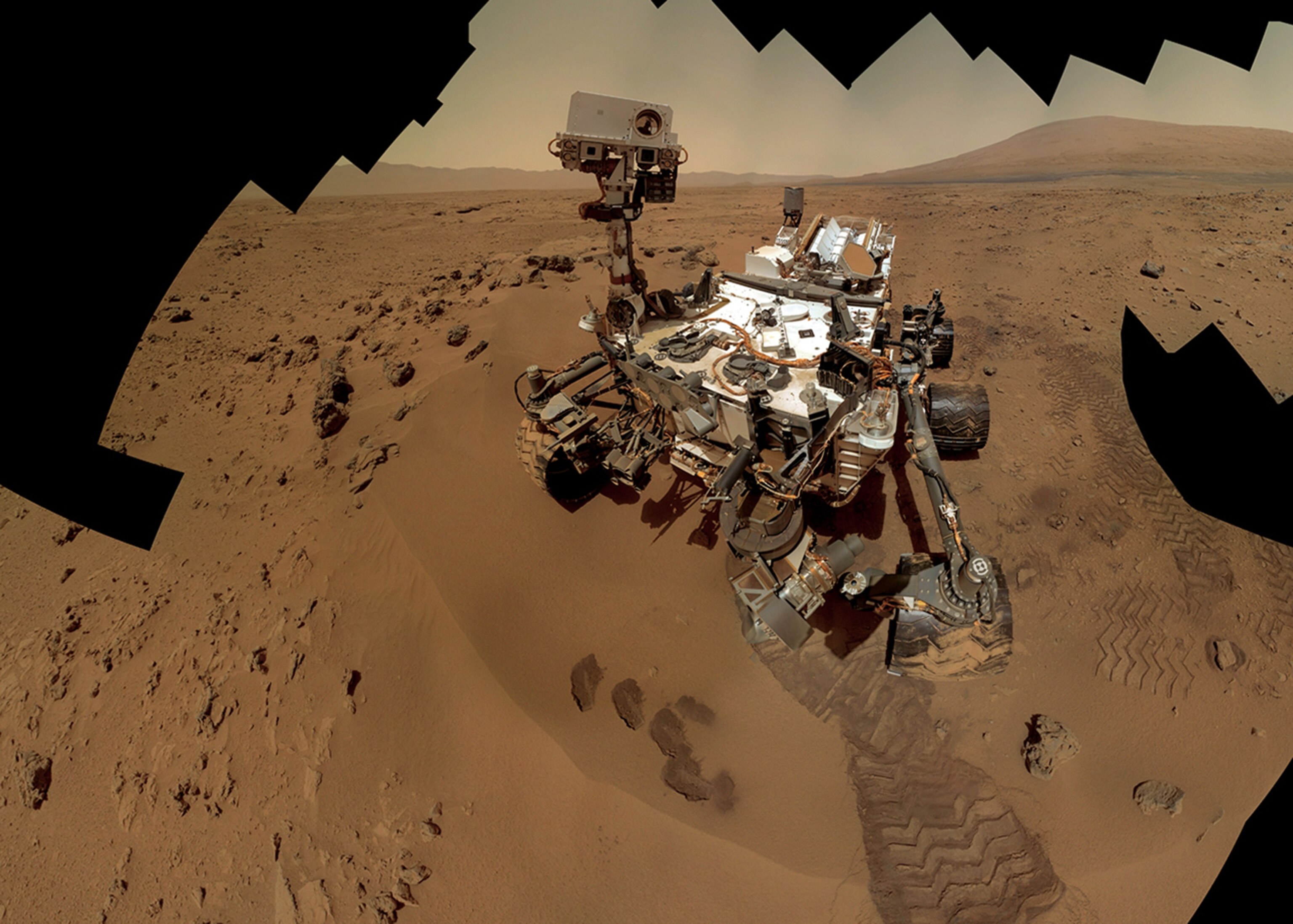 a self-portrait of rover Curiosity after taking its first scoops of Martian soil