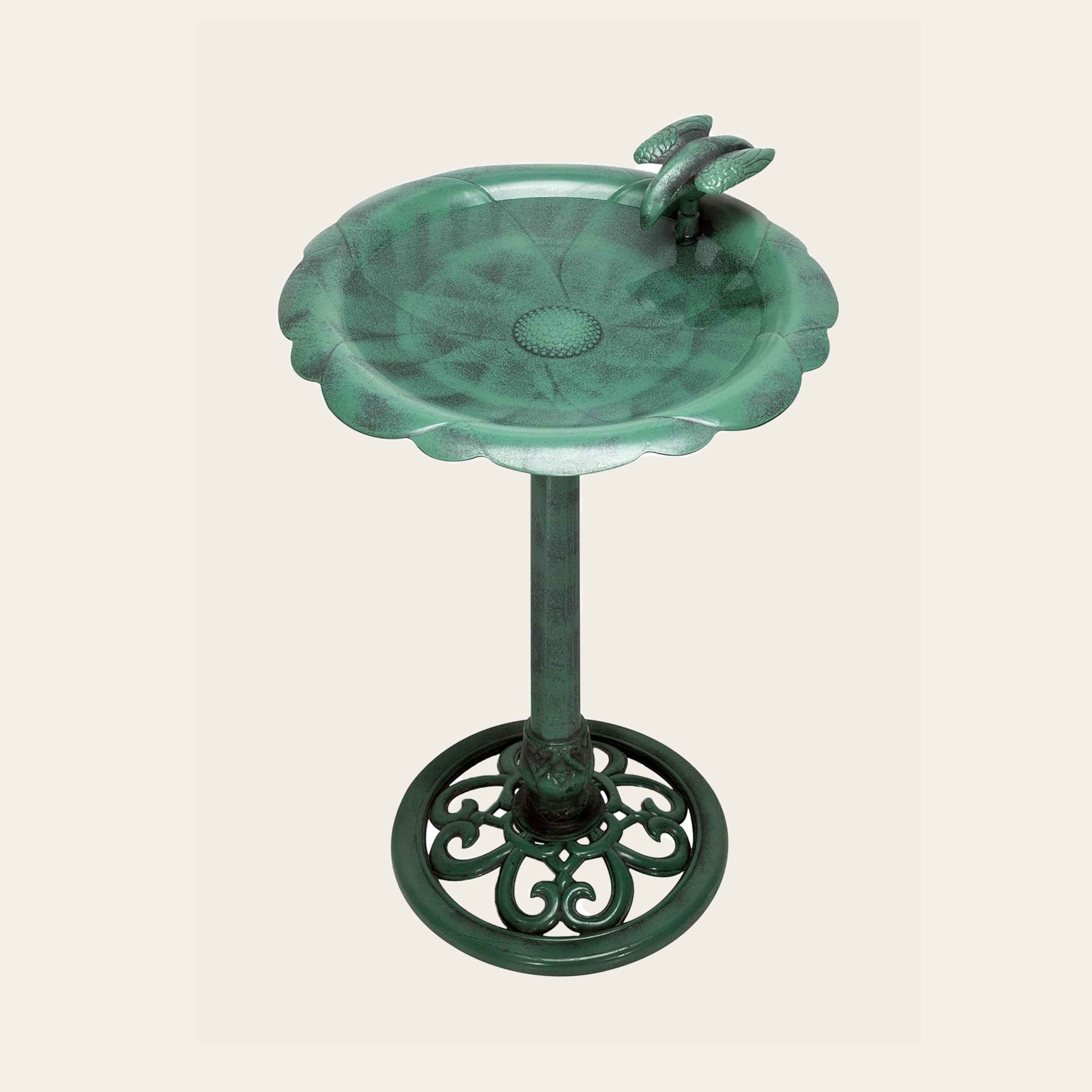 An image of a green birdbath.