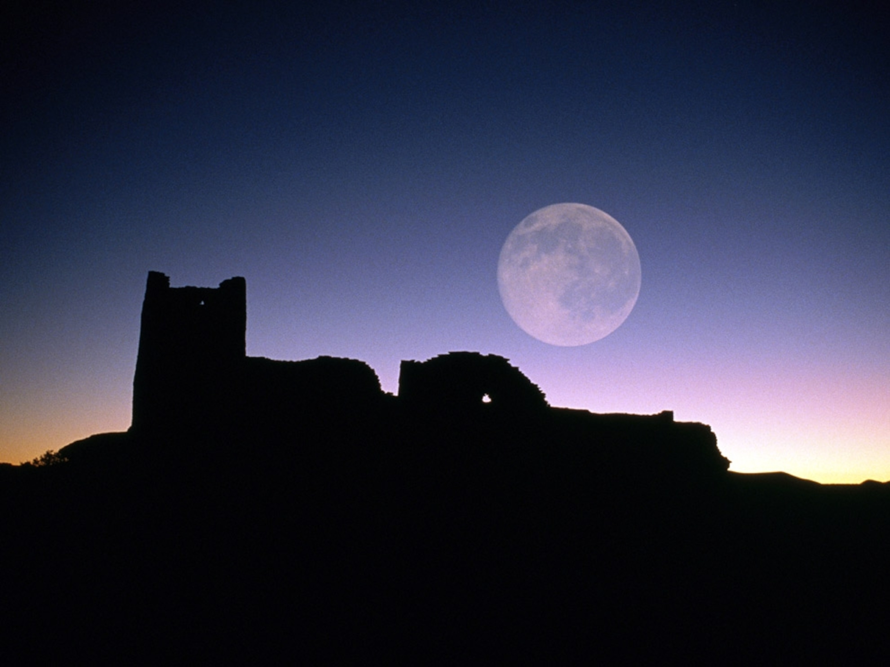 Moon over ancient ruins