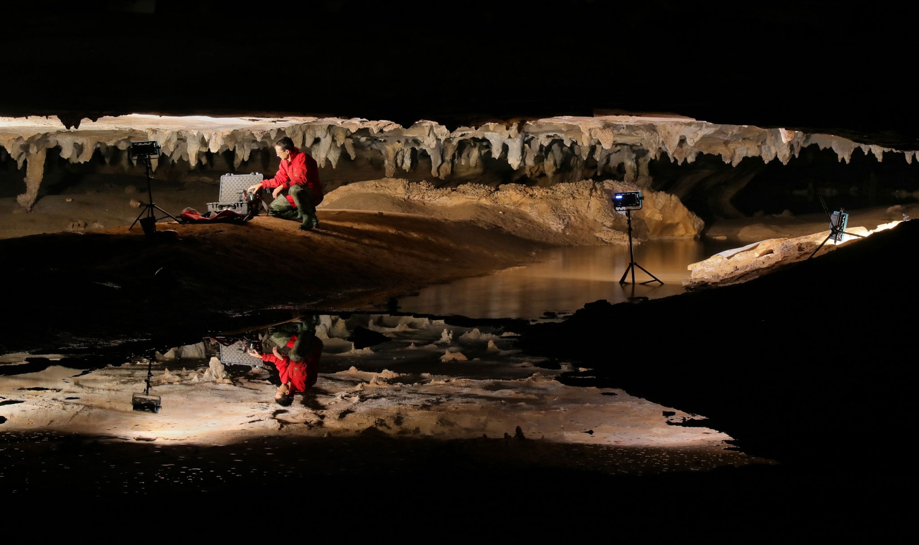 Stephen Alvarez in cave with largest mud glyphs in North America.