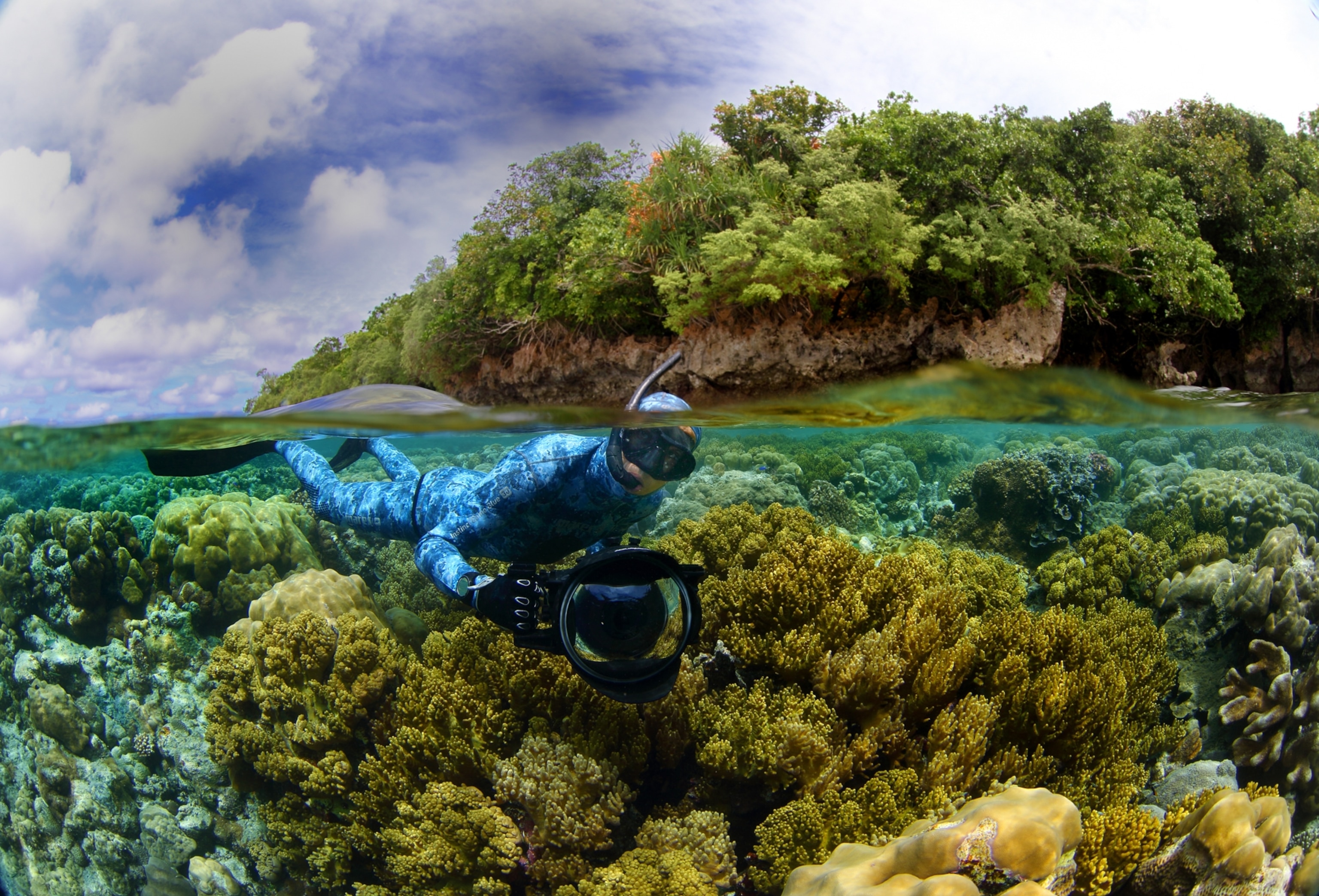 A man swimming under water