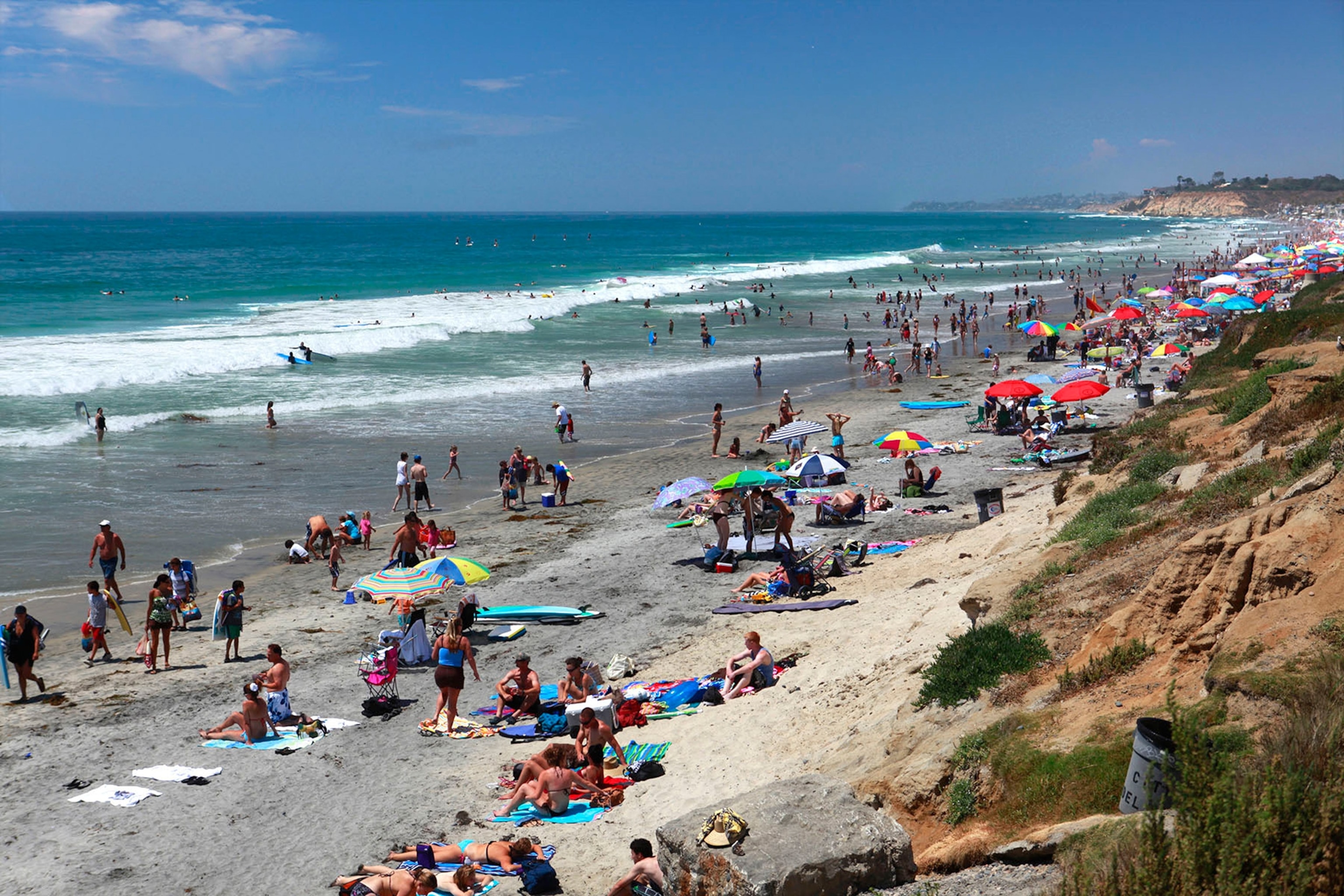 People at the beach on a sunny day in San Diego, California, USA.