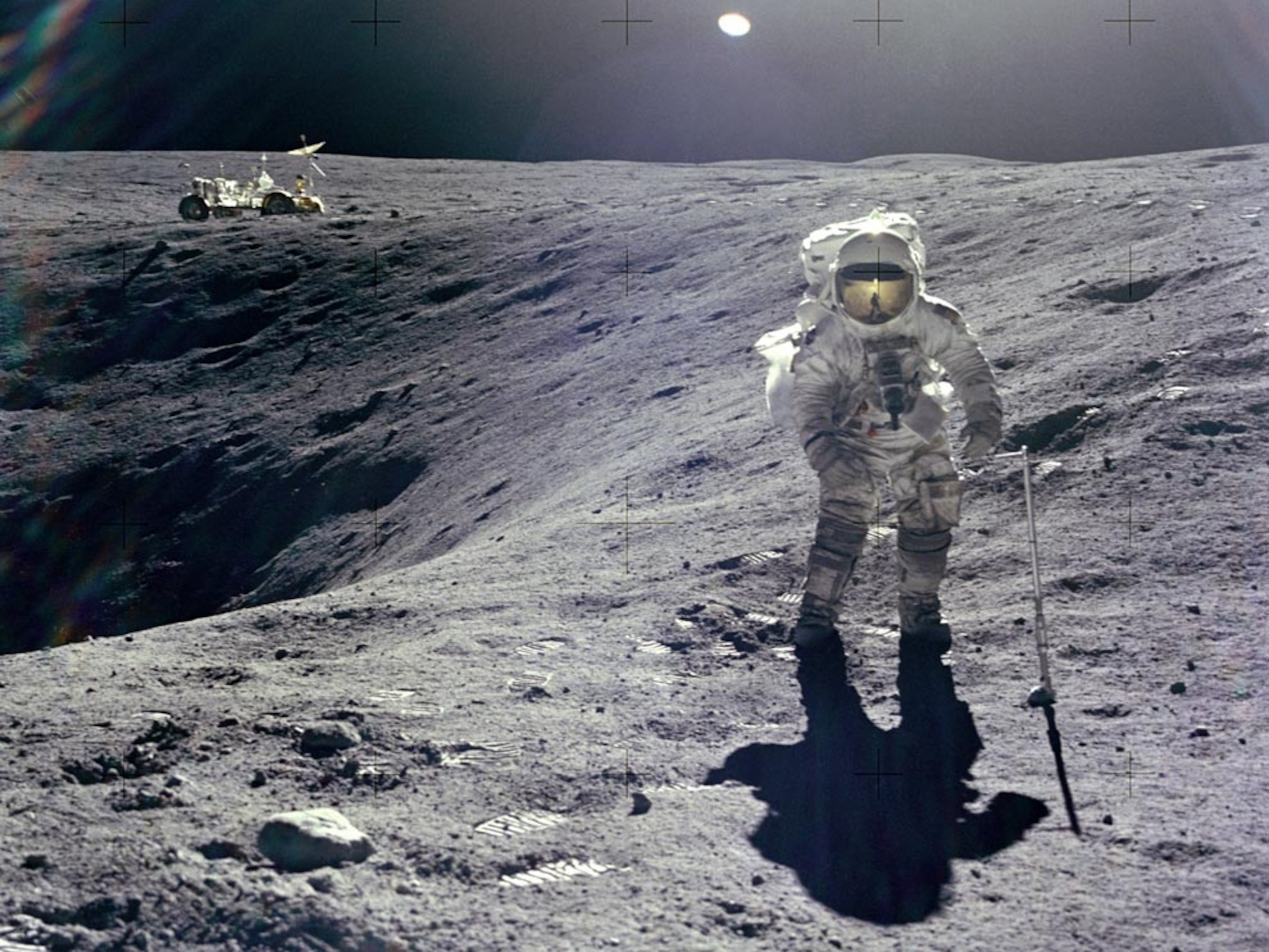 an astronaut at Plum Crater on the moon