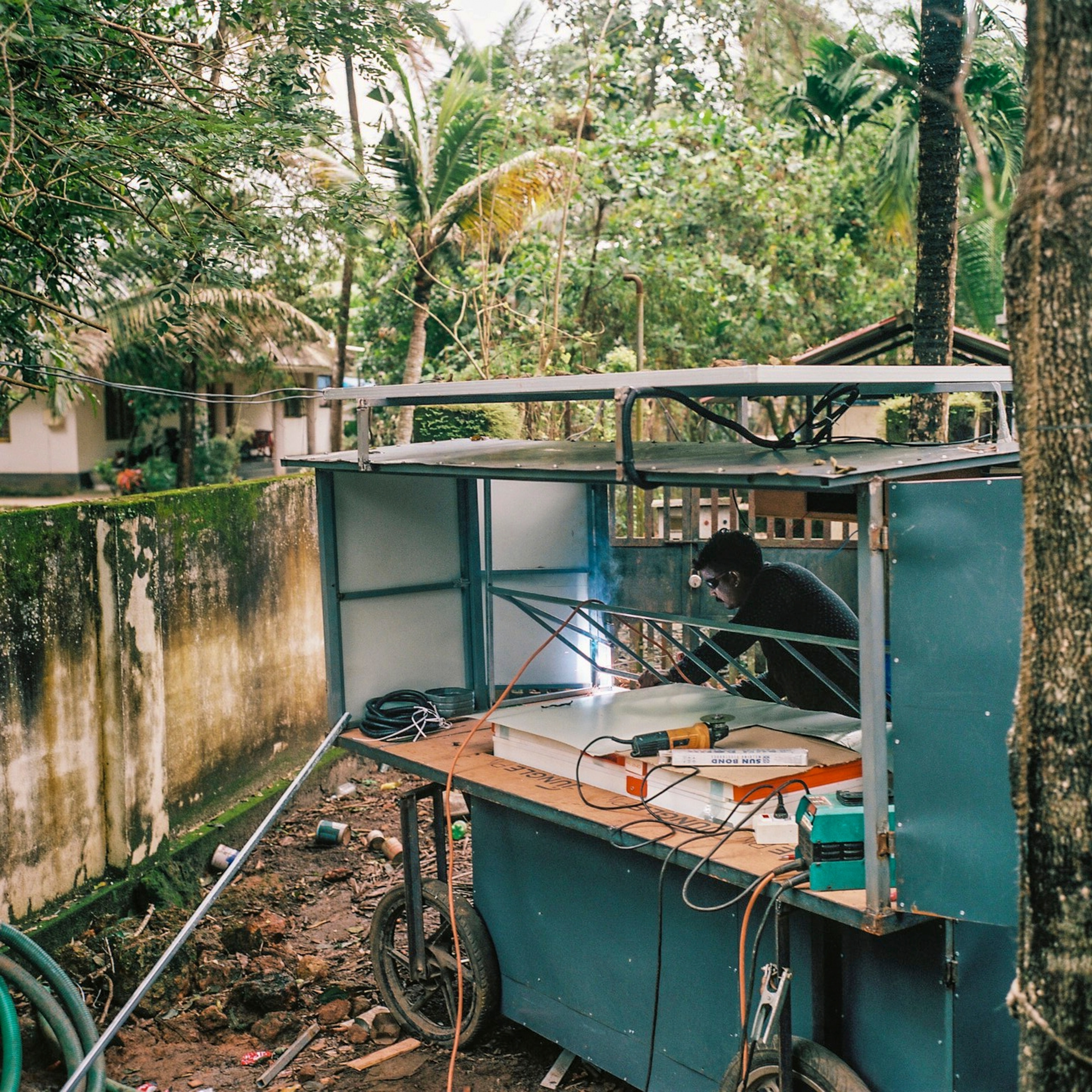 a solar energy installation company builds a solar vegetable cart