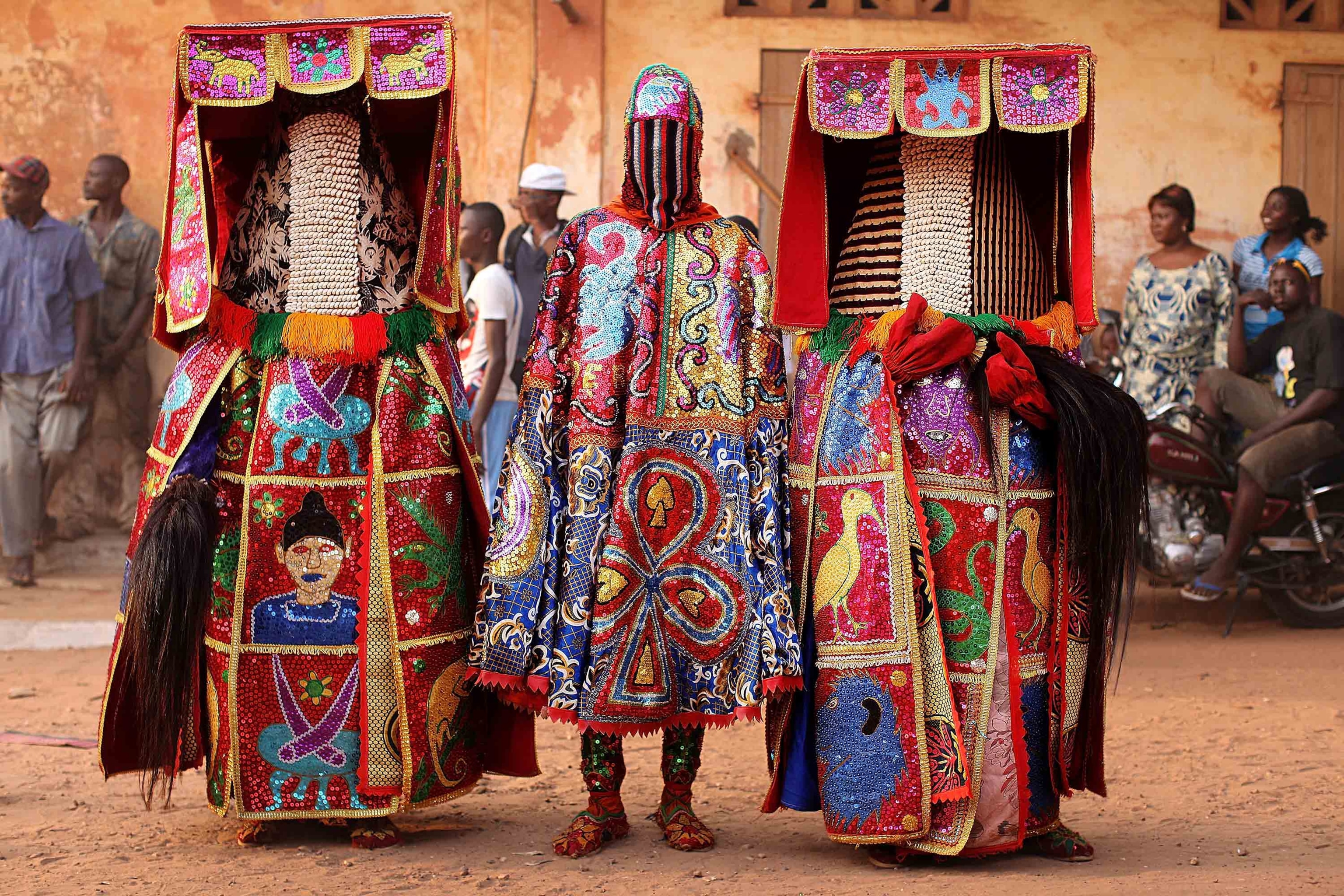 two people in traditional Egungun costumes, Nigeria