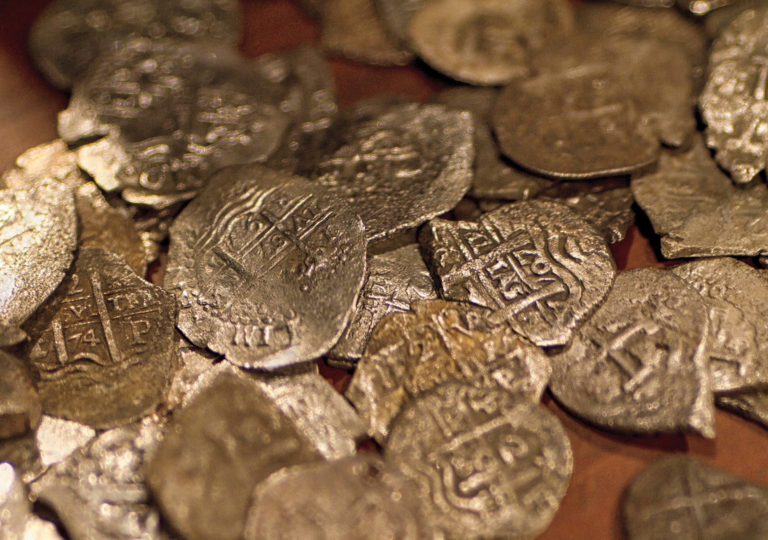 Prized Spanish coins, or pieces of eight, recovered from the wreck of the 'Whydah Gally'