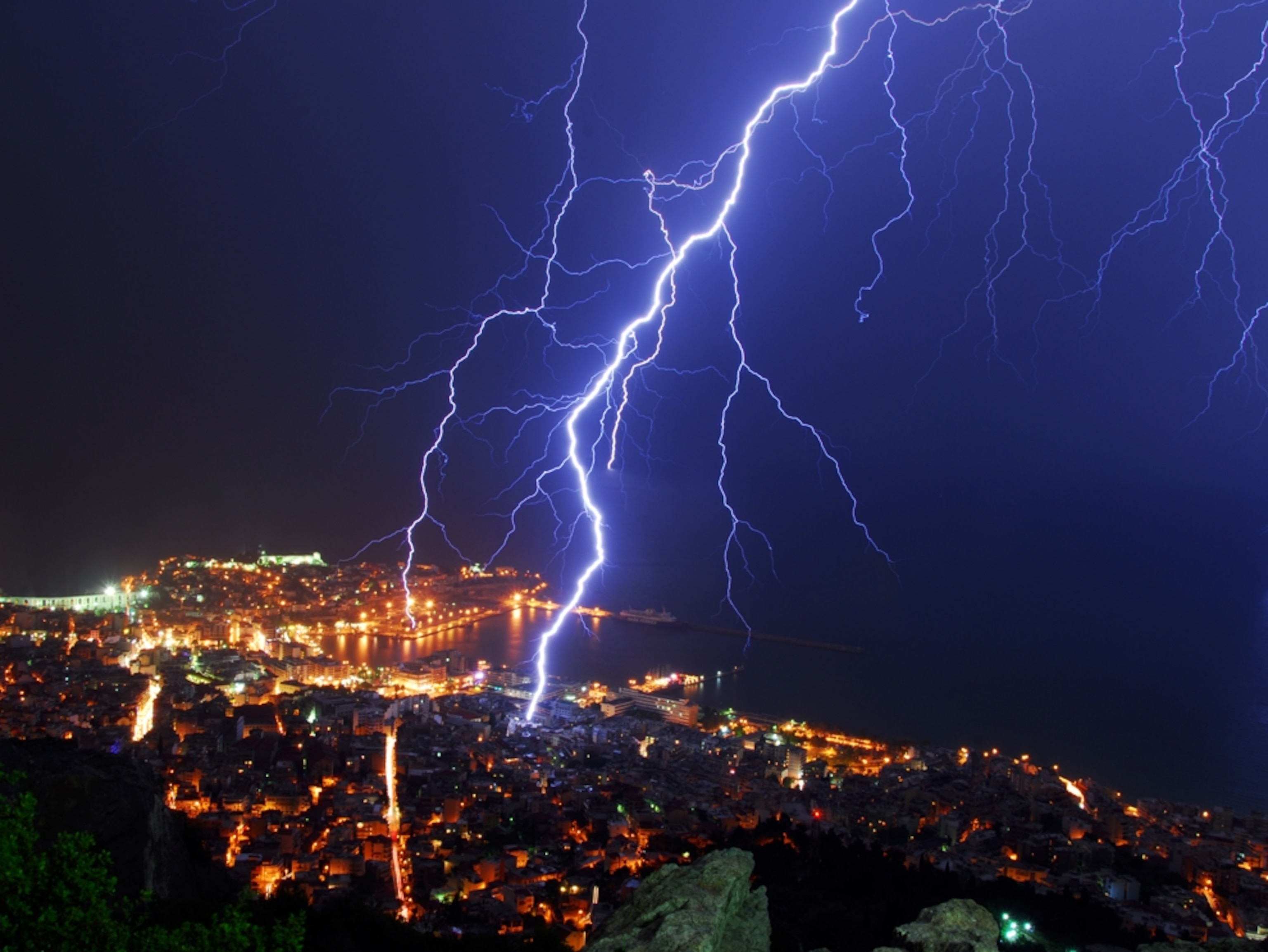 Lightning striking in the middle of a city