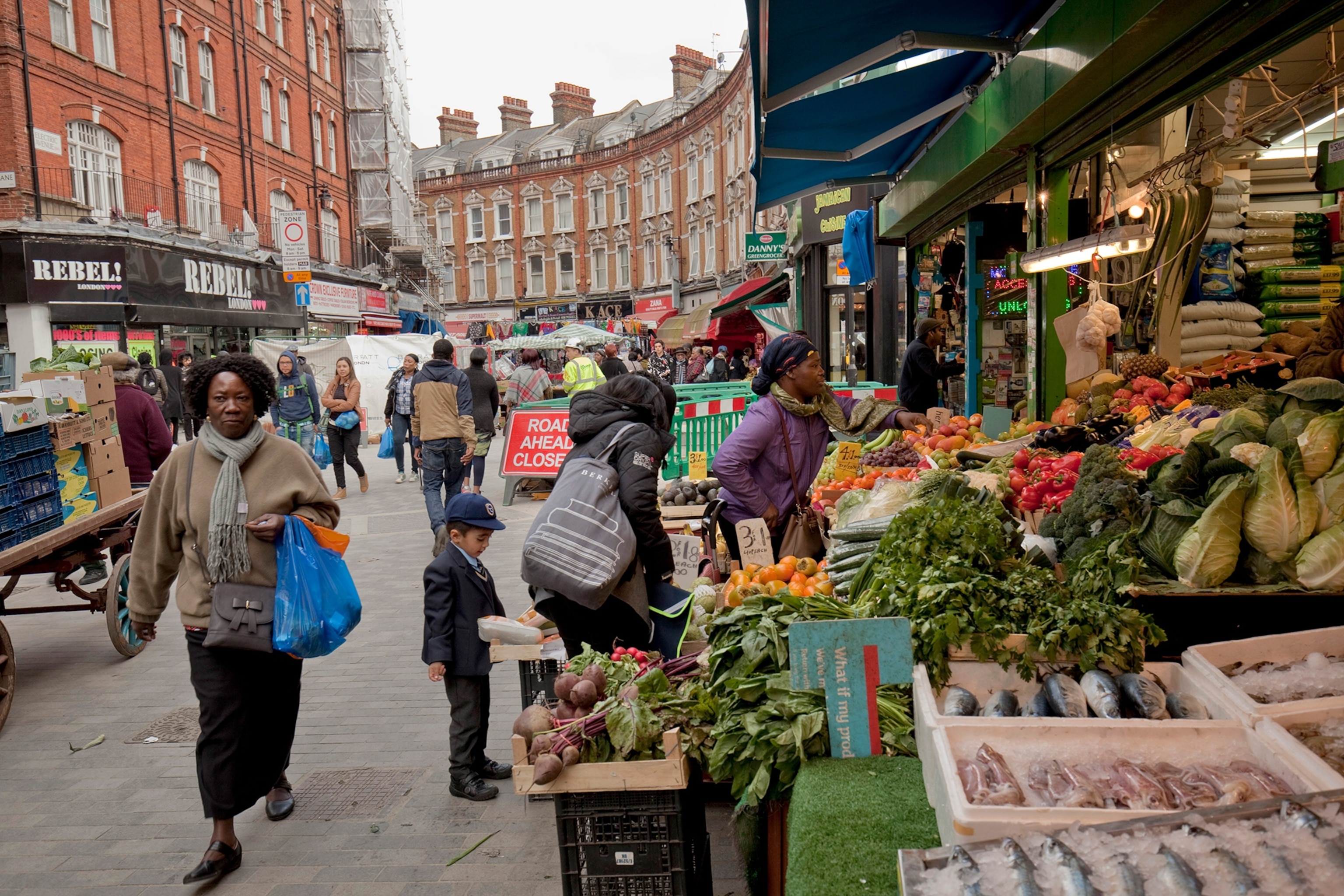 Shoppers at Brixton Market on Electric Avenue, Lambeth, London.