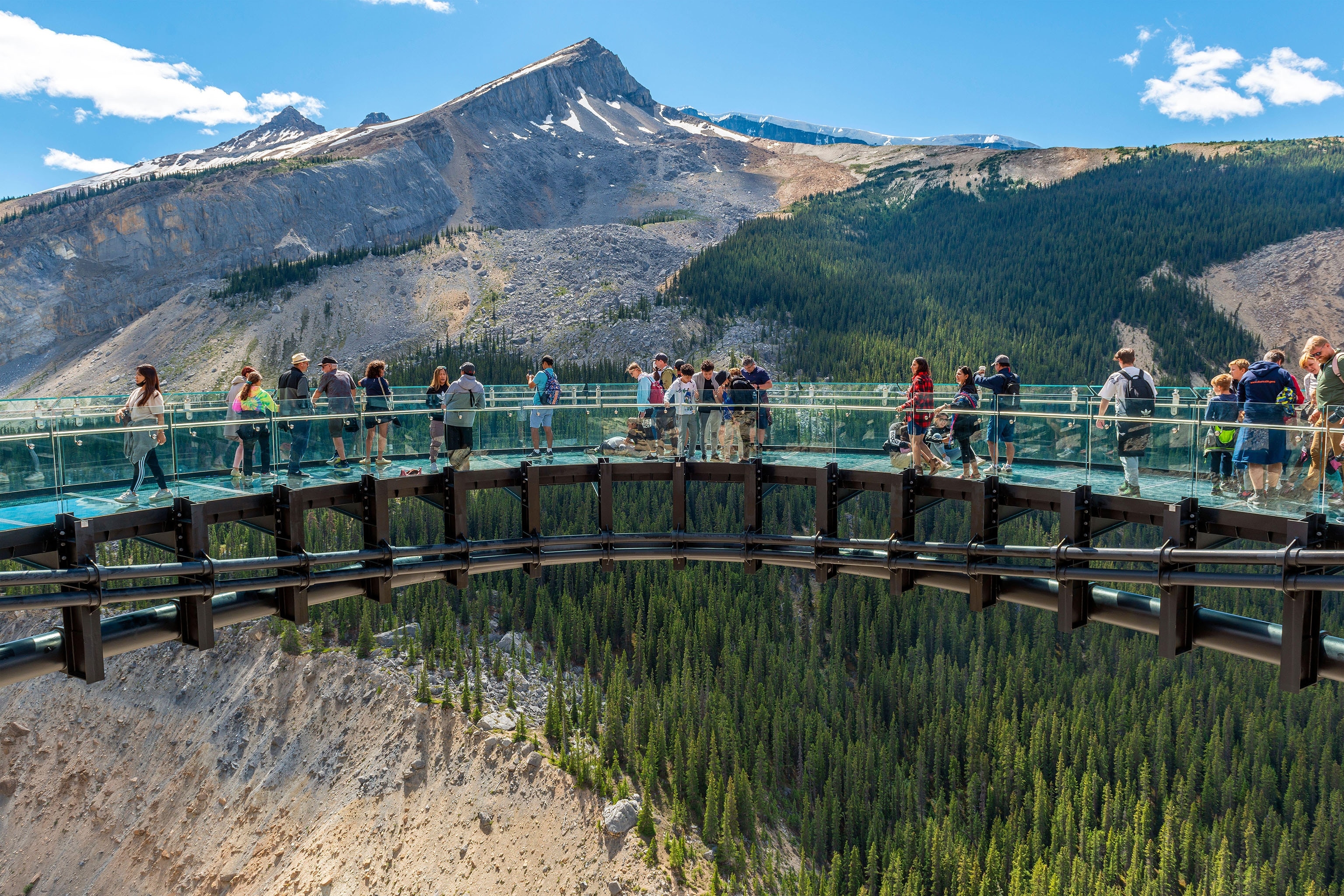 Tourists walking on Columbia Icefield Skywalk, Athabasca glacier, Jasper national park, Canada.