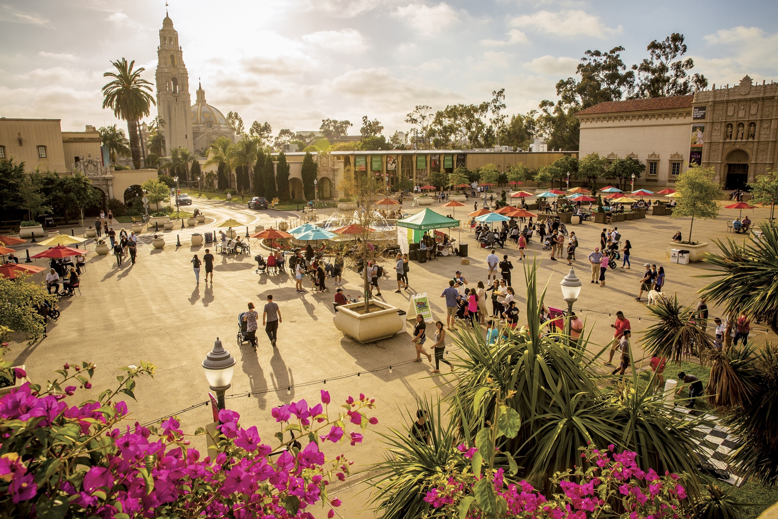 People walk through Balboa Park's Plaza de Panama. The tower and dome grace the San Diego Museum of Man, devoted to anthropology.