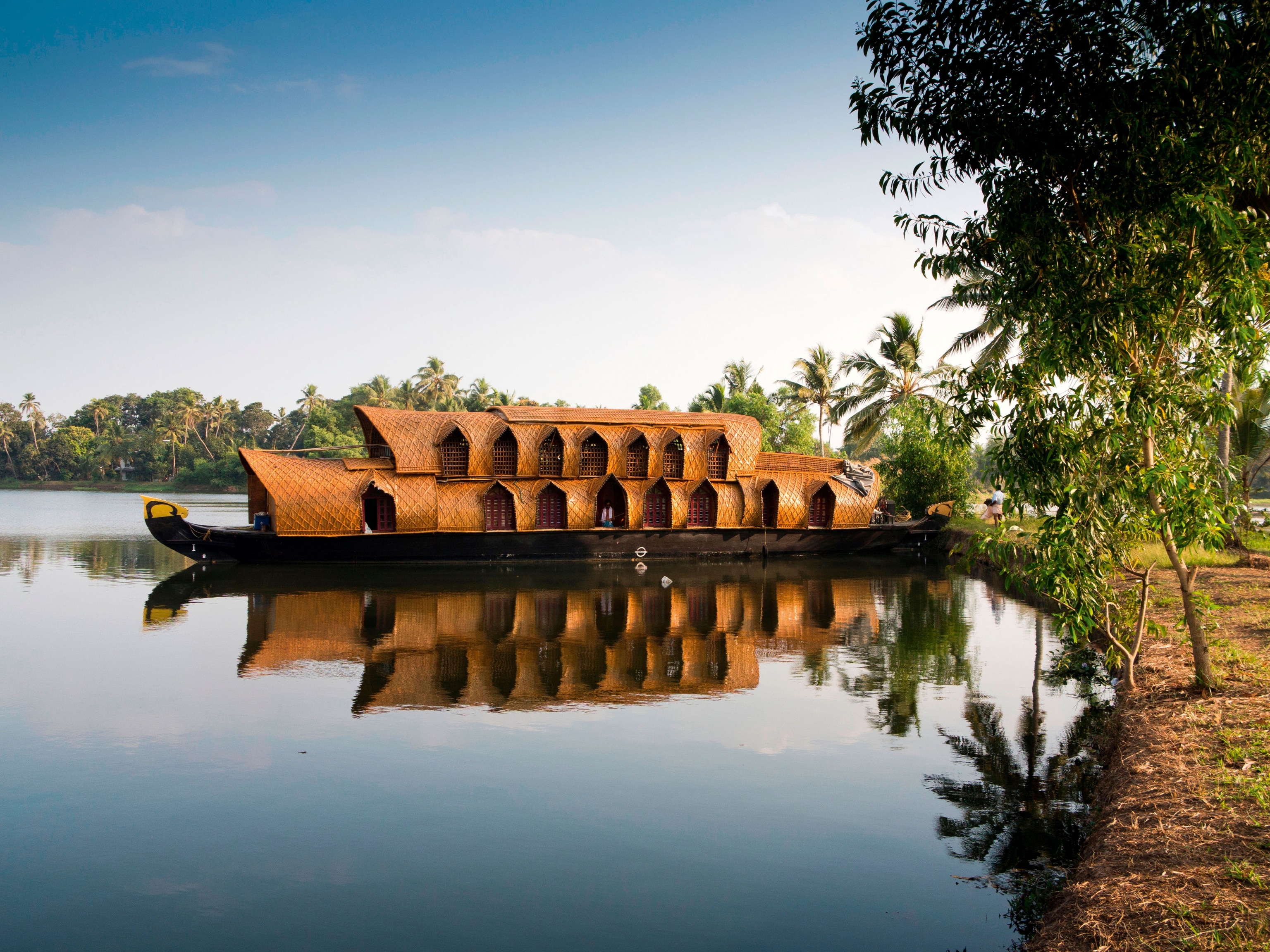Kerala, backwaters, Kettuvallam boat trip houseboat reflected in backwater