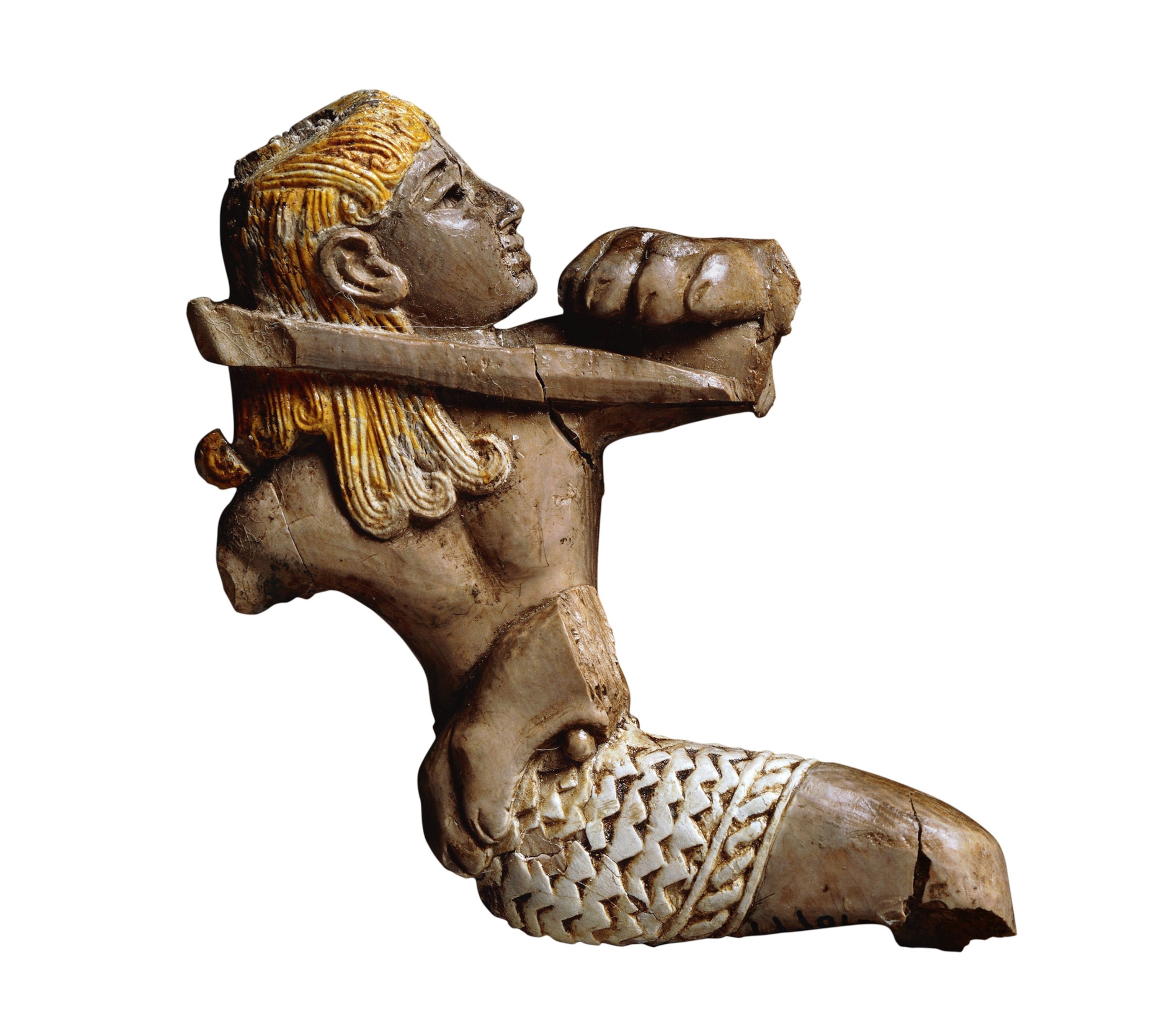 an ivory fragment depicting a blond youth confronting a lioness