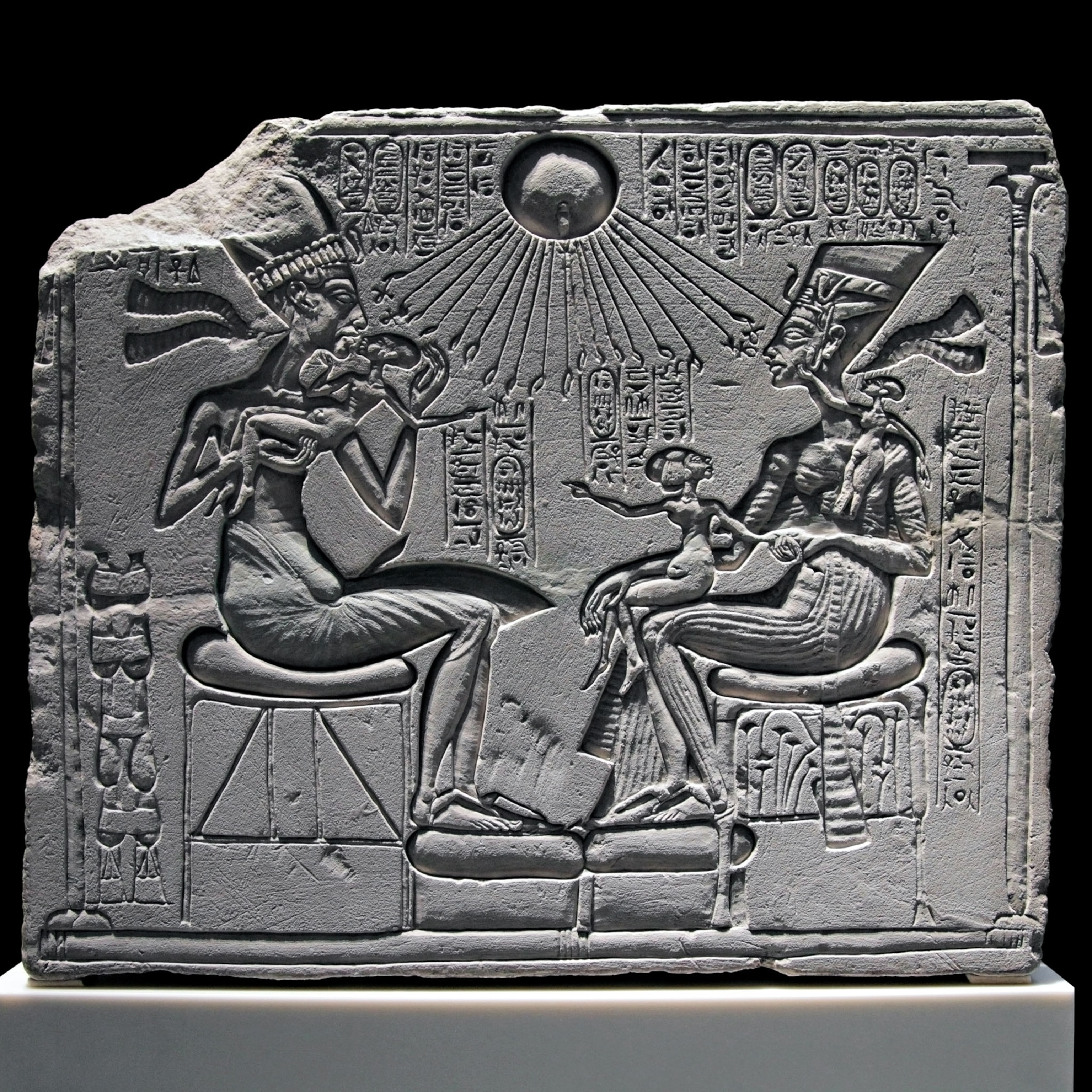 limestone stela with Akhenaten and Nefertiti and three daughters under the sun god Aten.