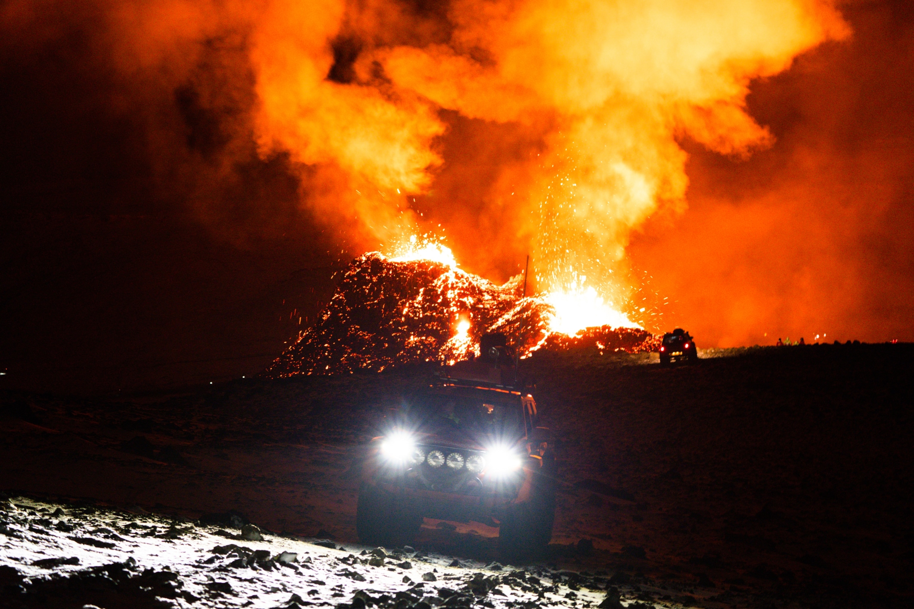 Search and Rescue teams drive around the volcano site