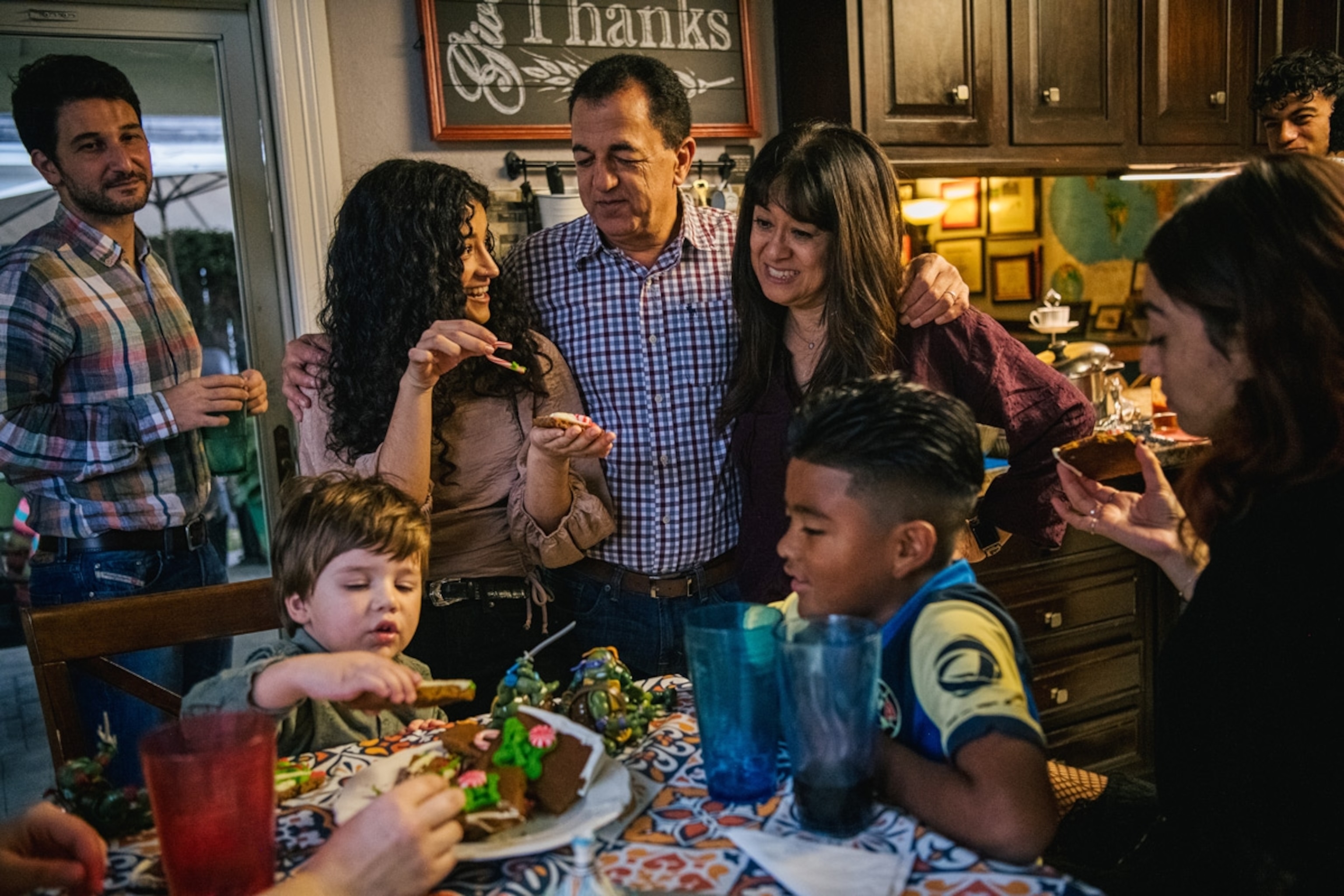 The Villagrana-Ocasio, Parish Moreno, and Yagar Dalton families bond together after a Thanksgiving meal on November 25, 2021 in Houston, Texas.