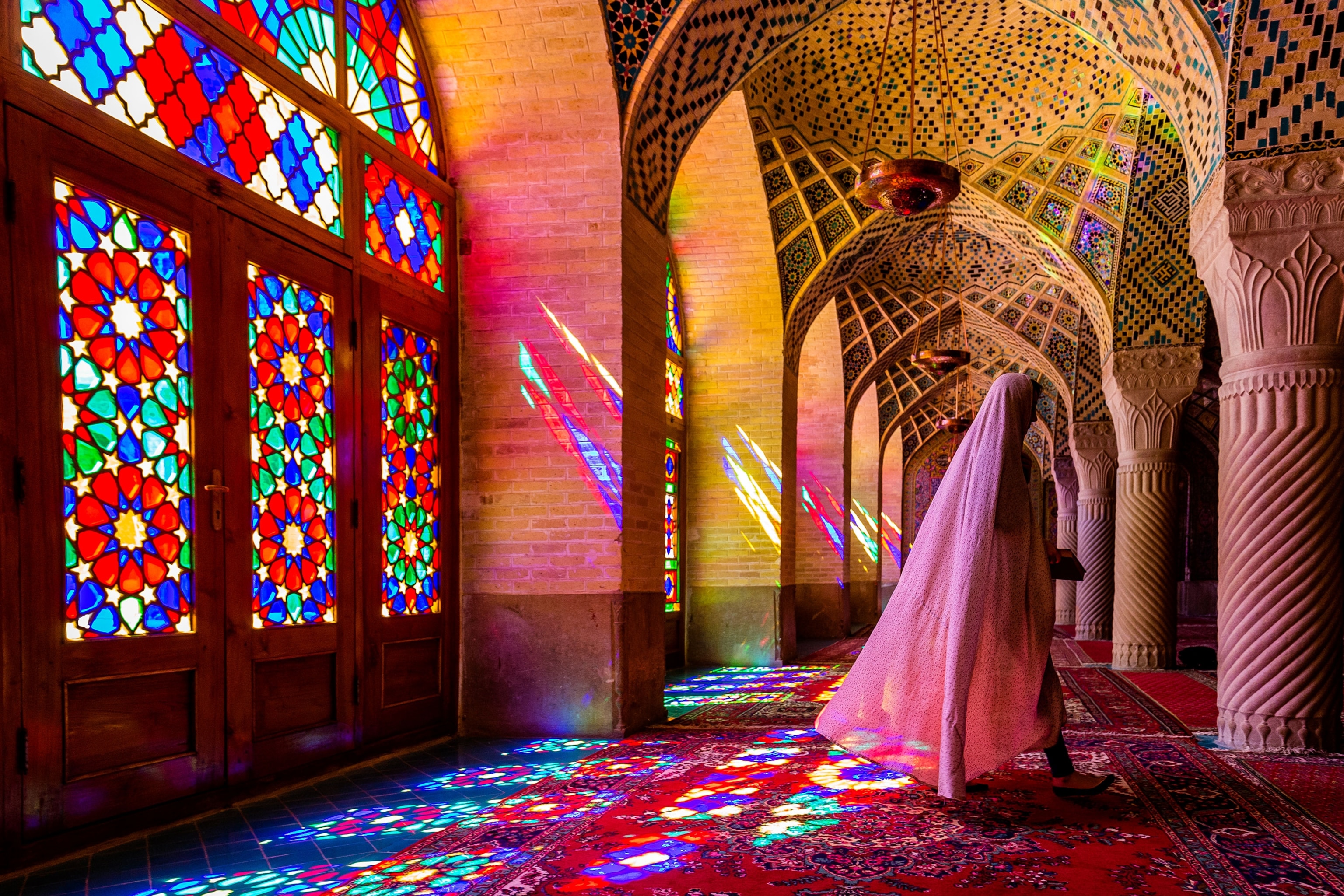 a woman in Nasir Al Molk Mosque in Iran