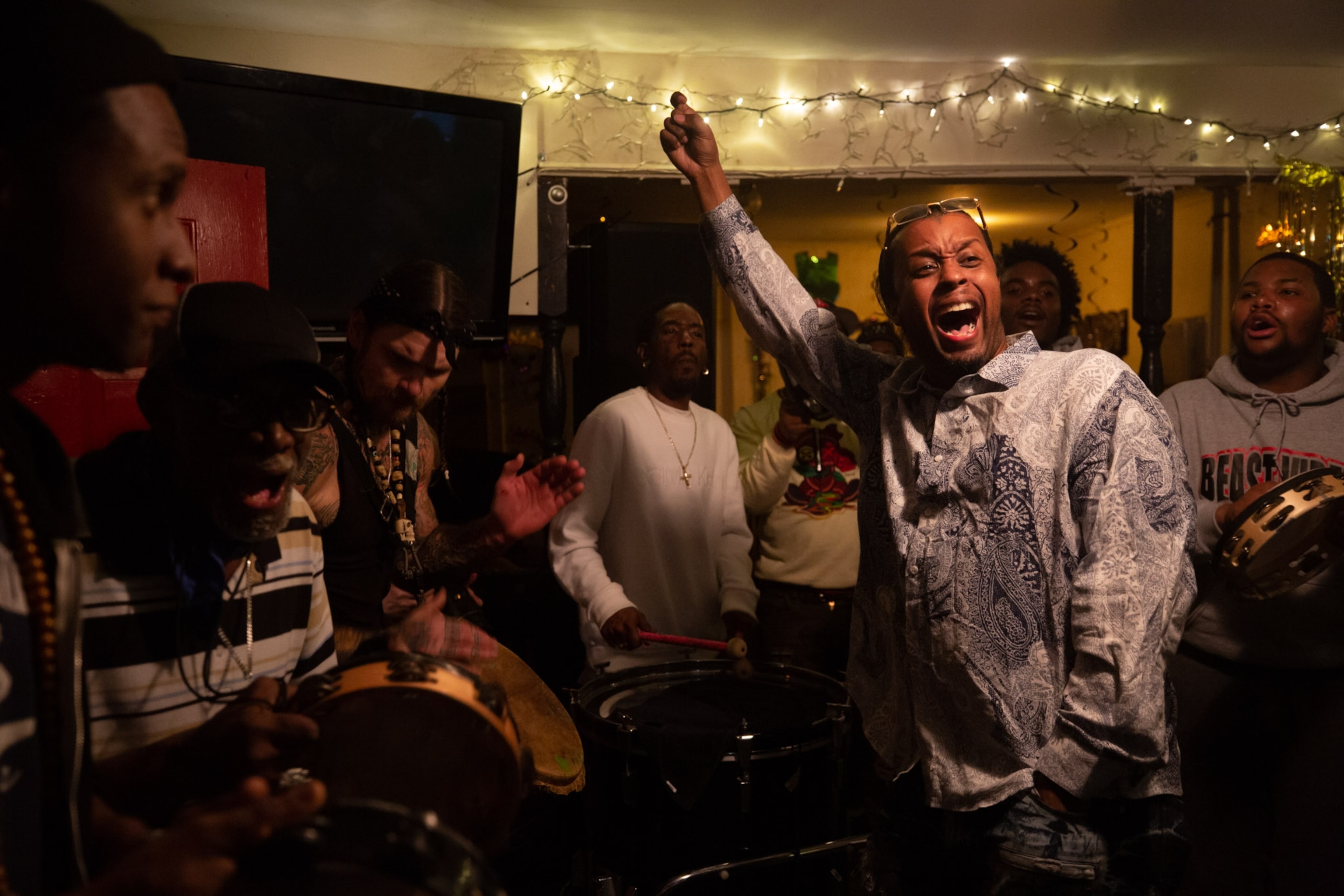a person singing along to a group of musicians playing music