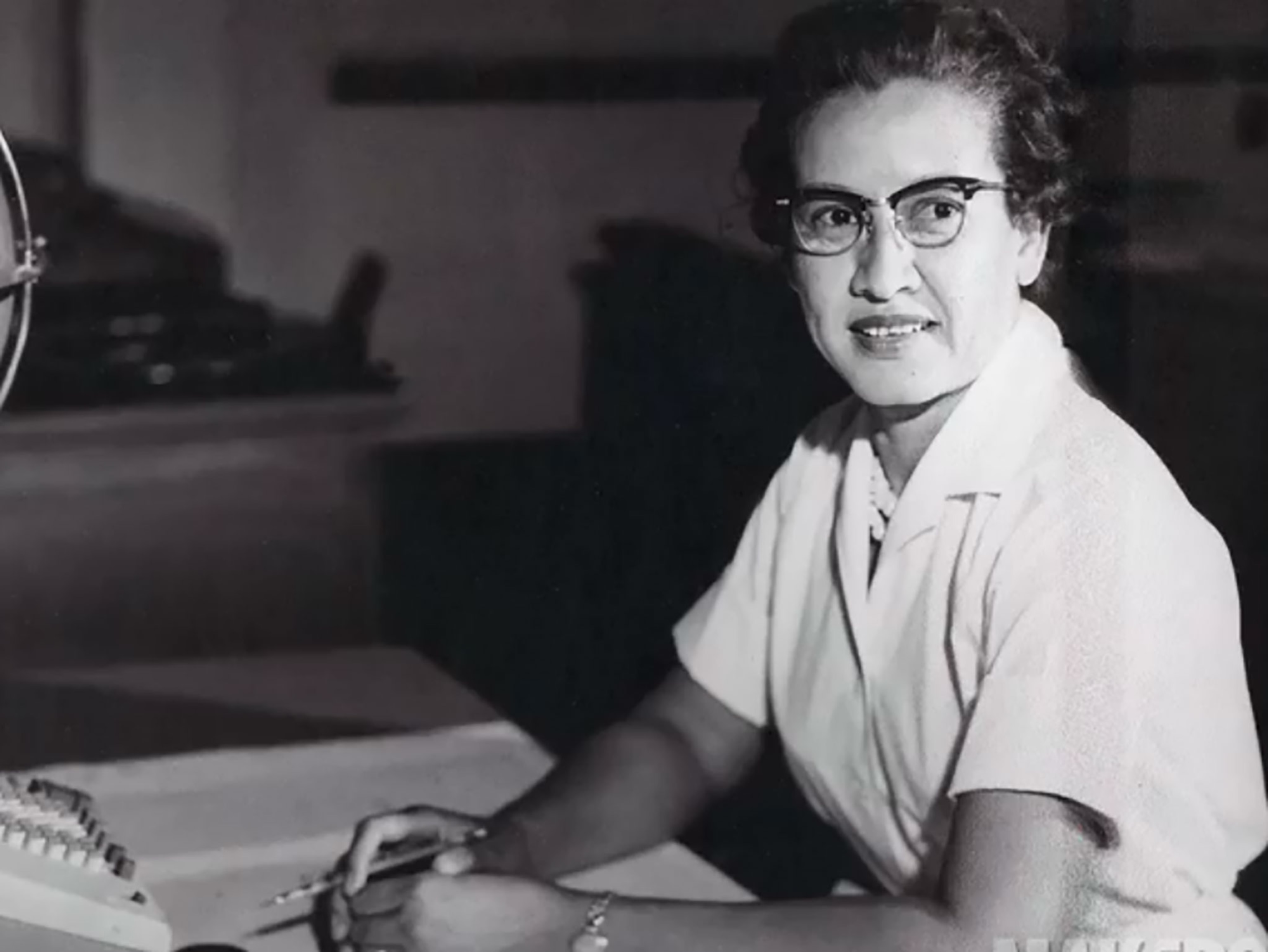 a woman sitting at a desk at Langley Research Center, Virginia