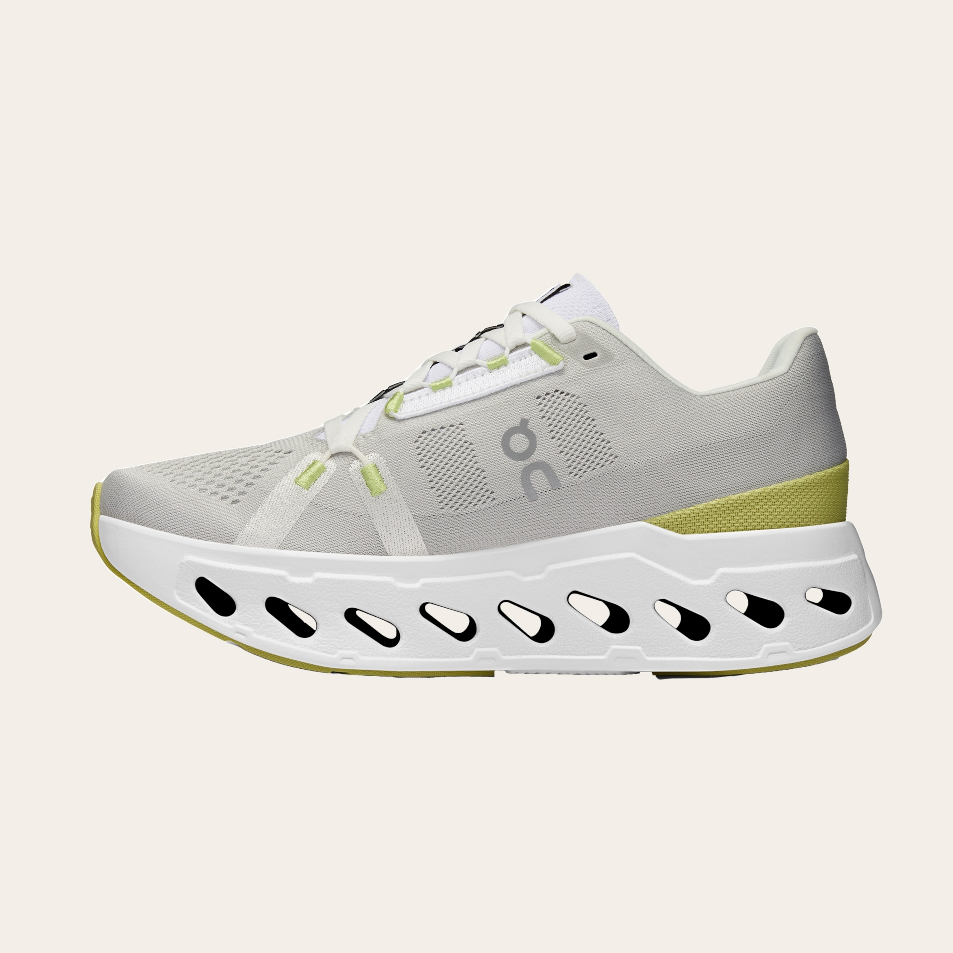 An image of white sneakers with yellow-green accents.