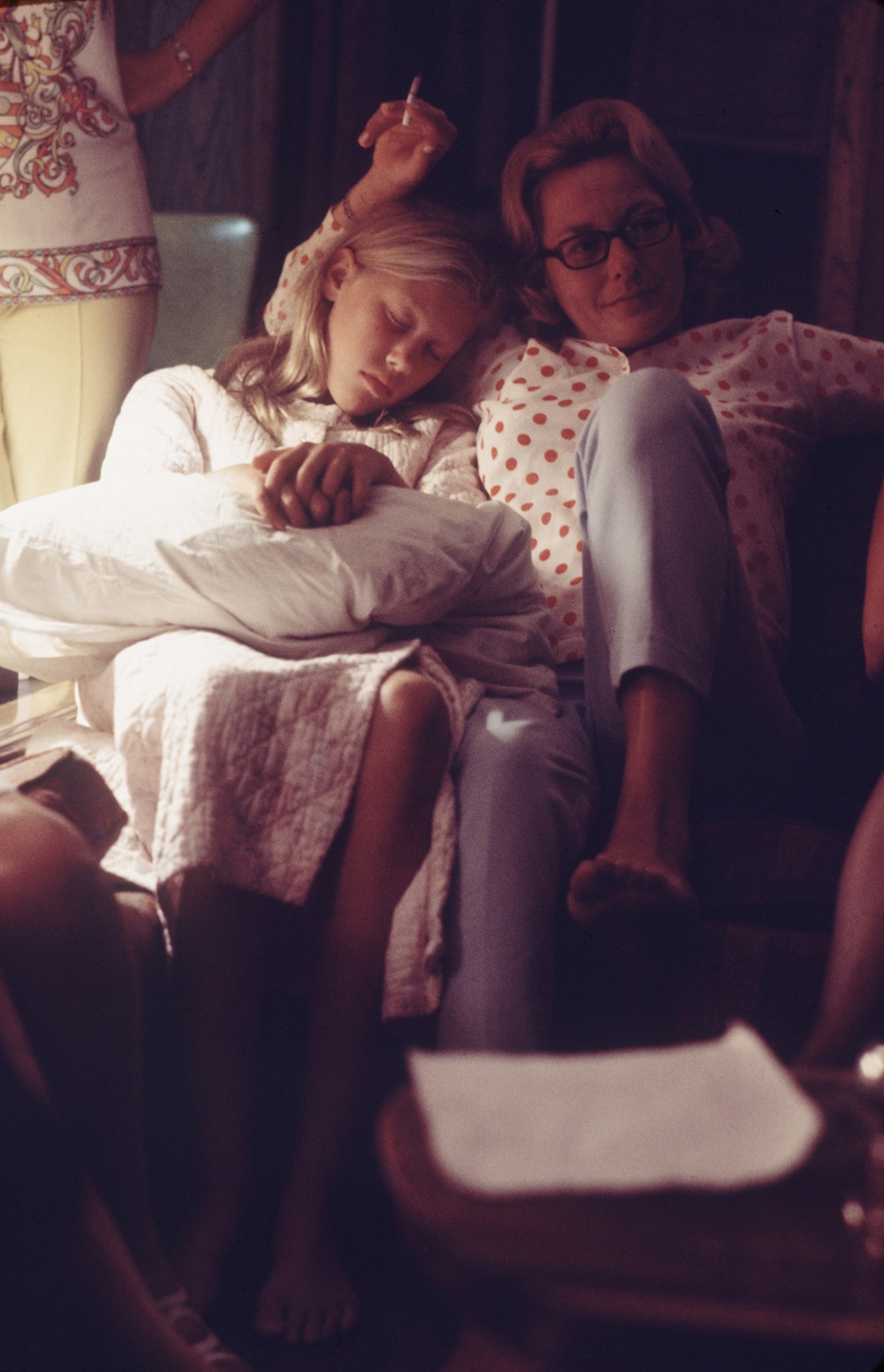 a woman and girl on a sofa