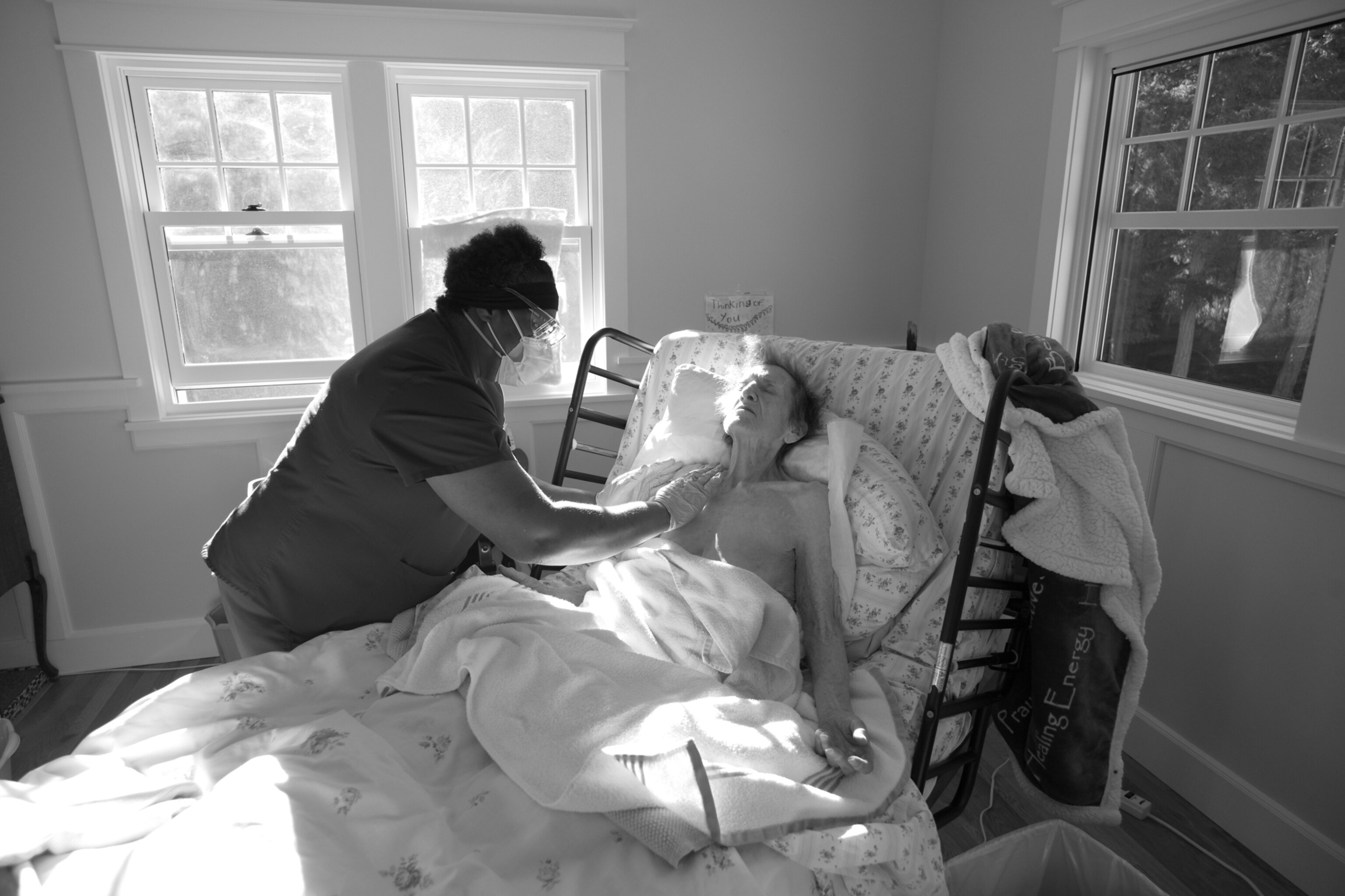 a home healthcare worker tends to a sick patient in Washington, United States