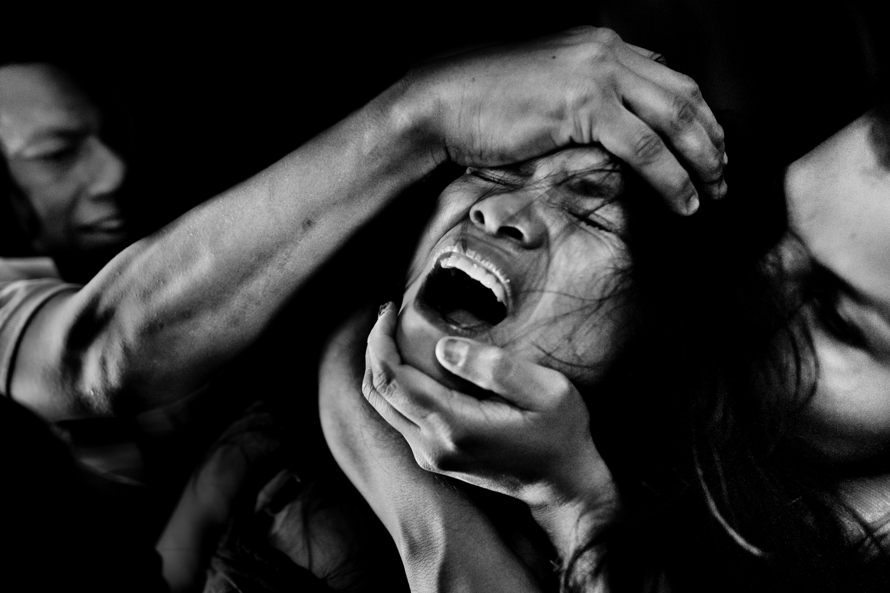 Photo of girl screaming with hands on her forehead and chin