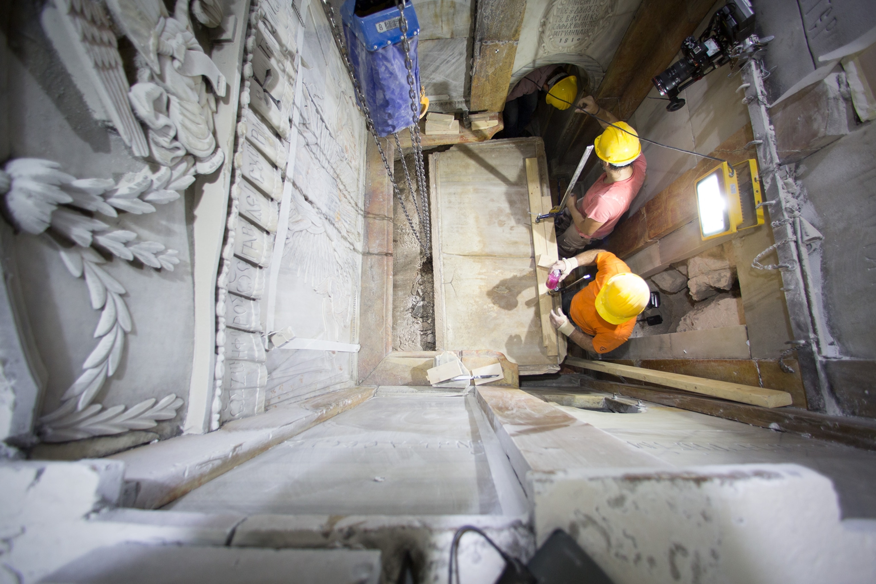 Workers remove the top of the tomb of Jesus