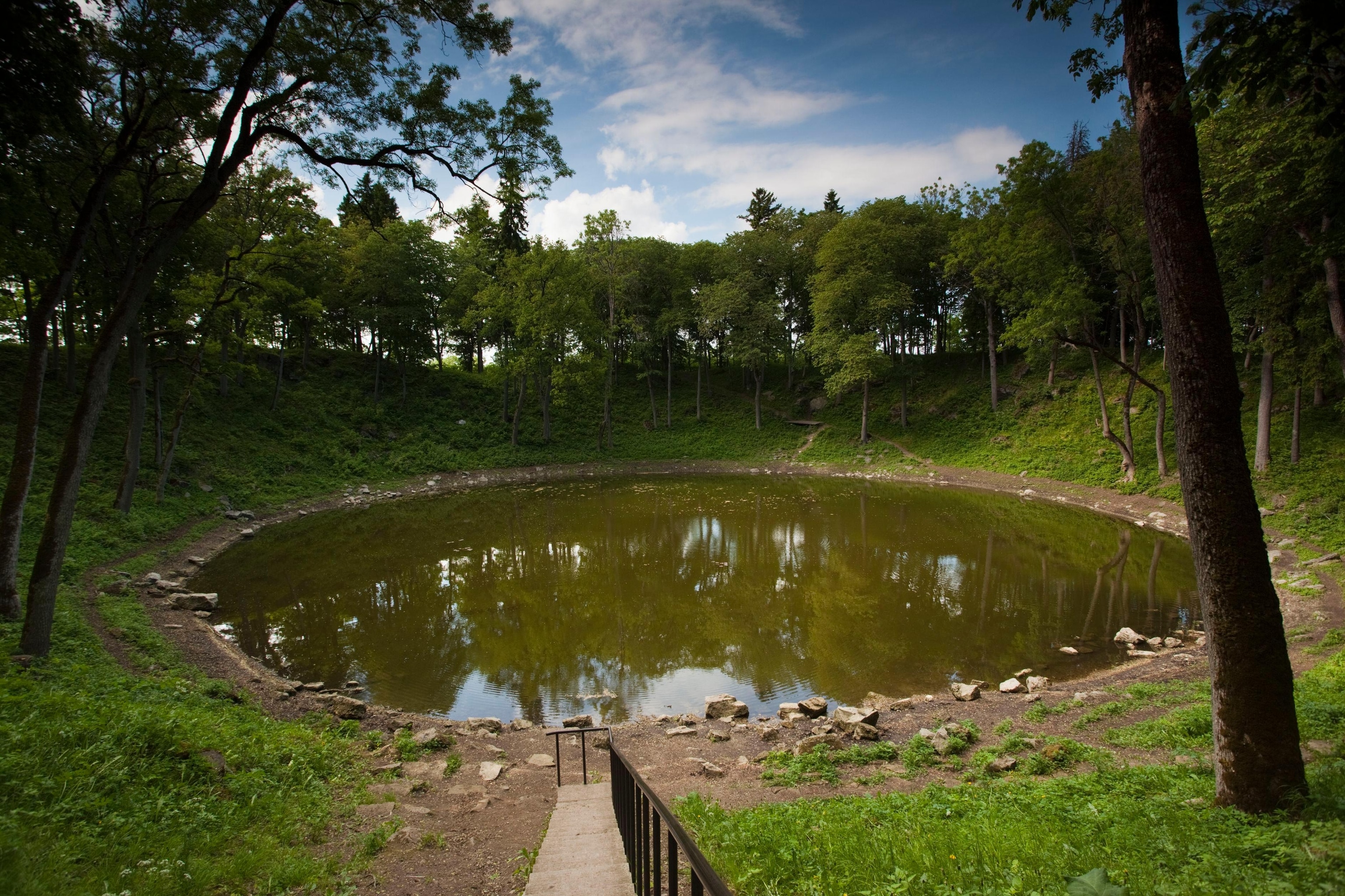 A circular pond with water.