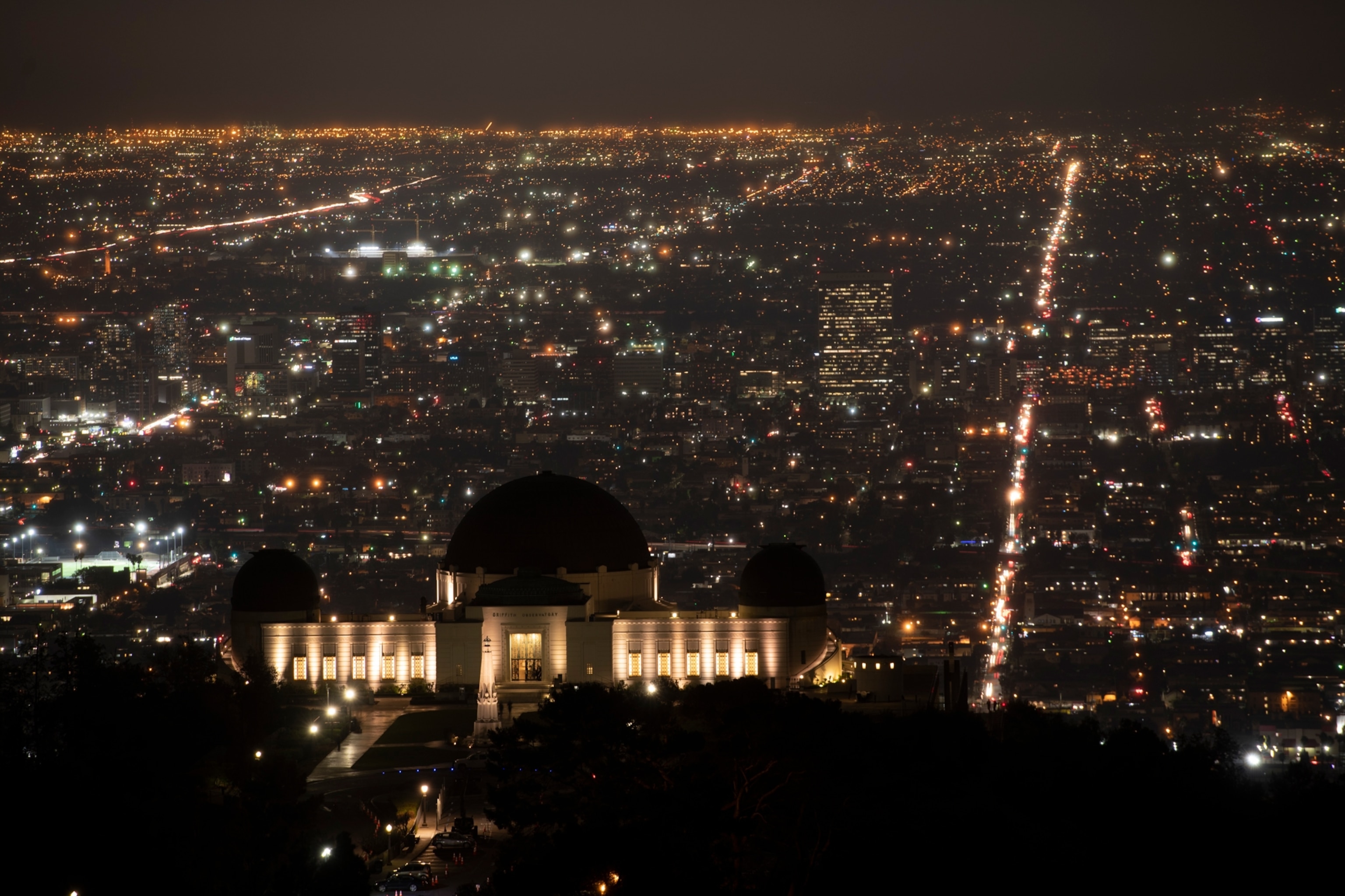 a white observatory building at night