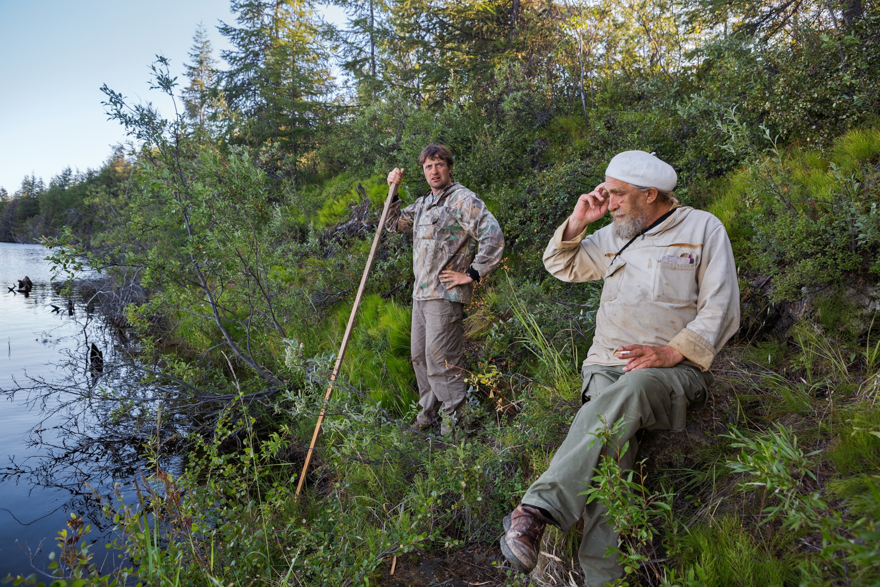 two men on rive bank.