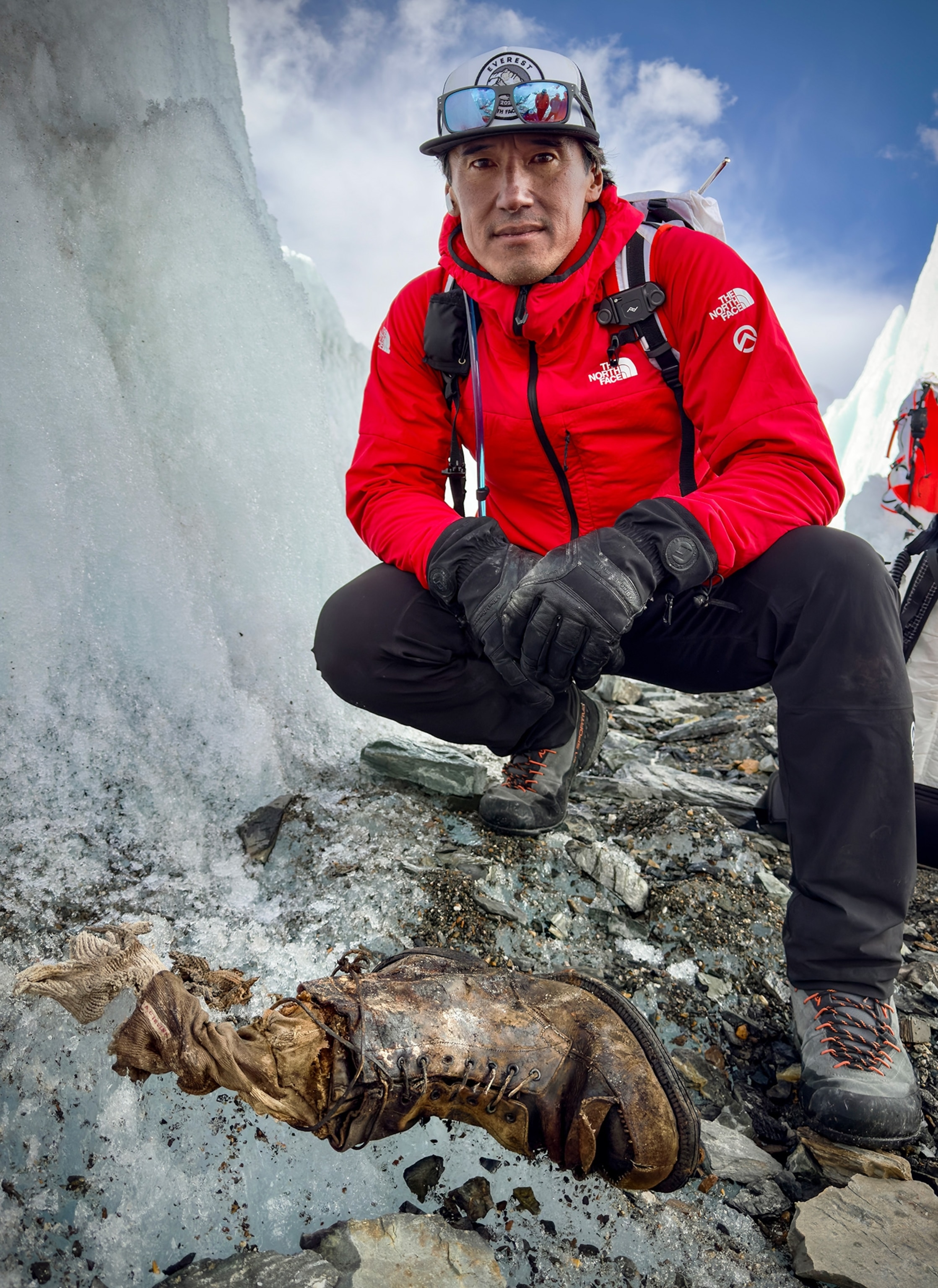Jimmy Chin on Everest with Sandy Irvine's partial remains emerging from the ice