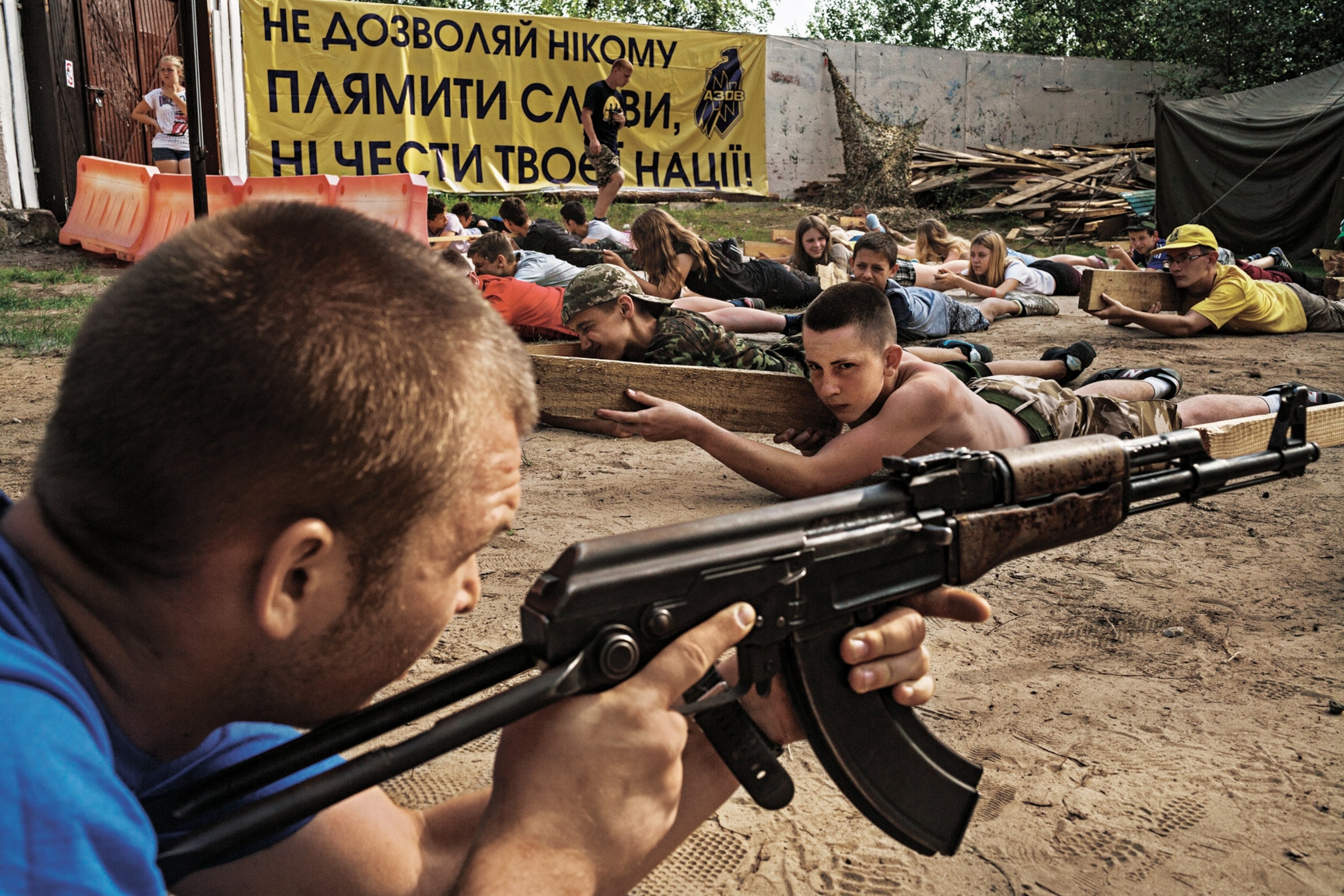 children laying down with guns