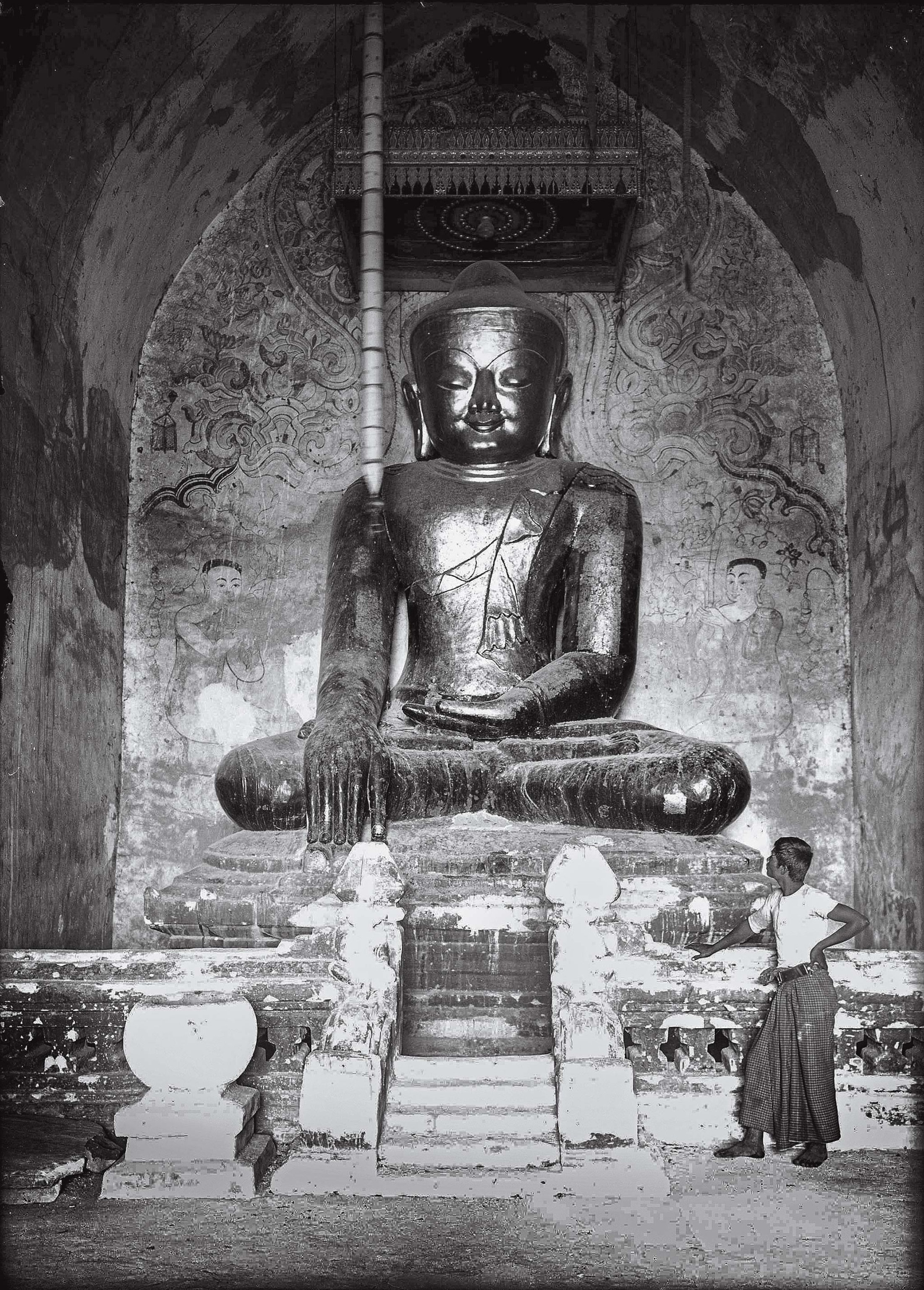 Photographed in 1931 for National Geographic, the main Buddha statue inside the tallest pagoda sits in a posture called bhumisparsha mudra, the ground touching gesture.