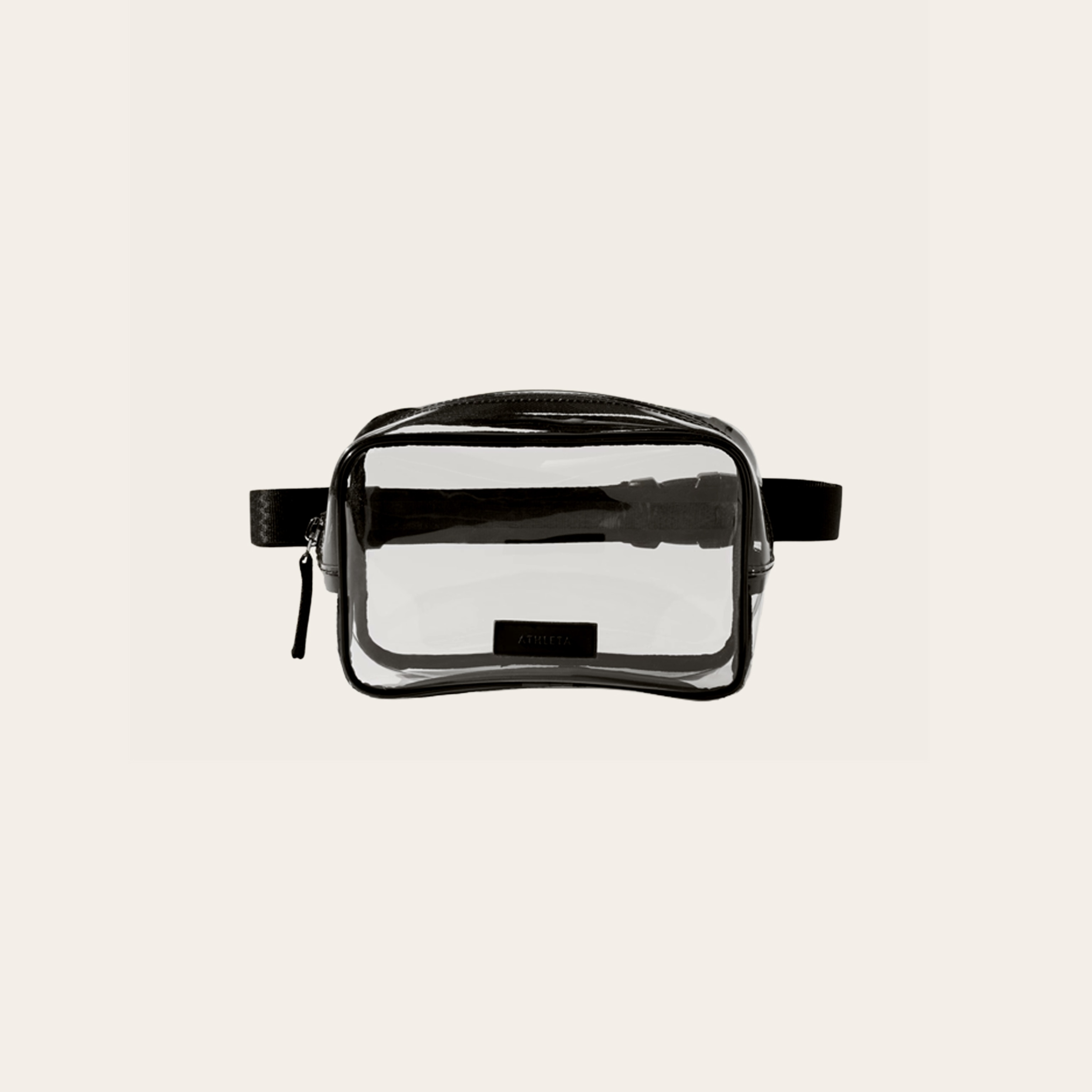 A clear bag with black detail on a cream bag.