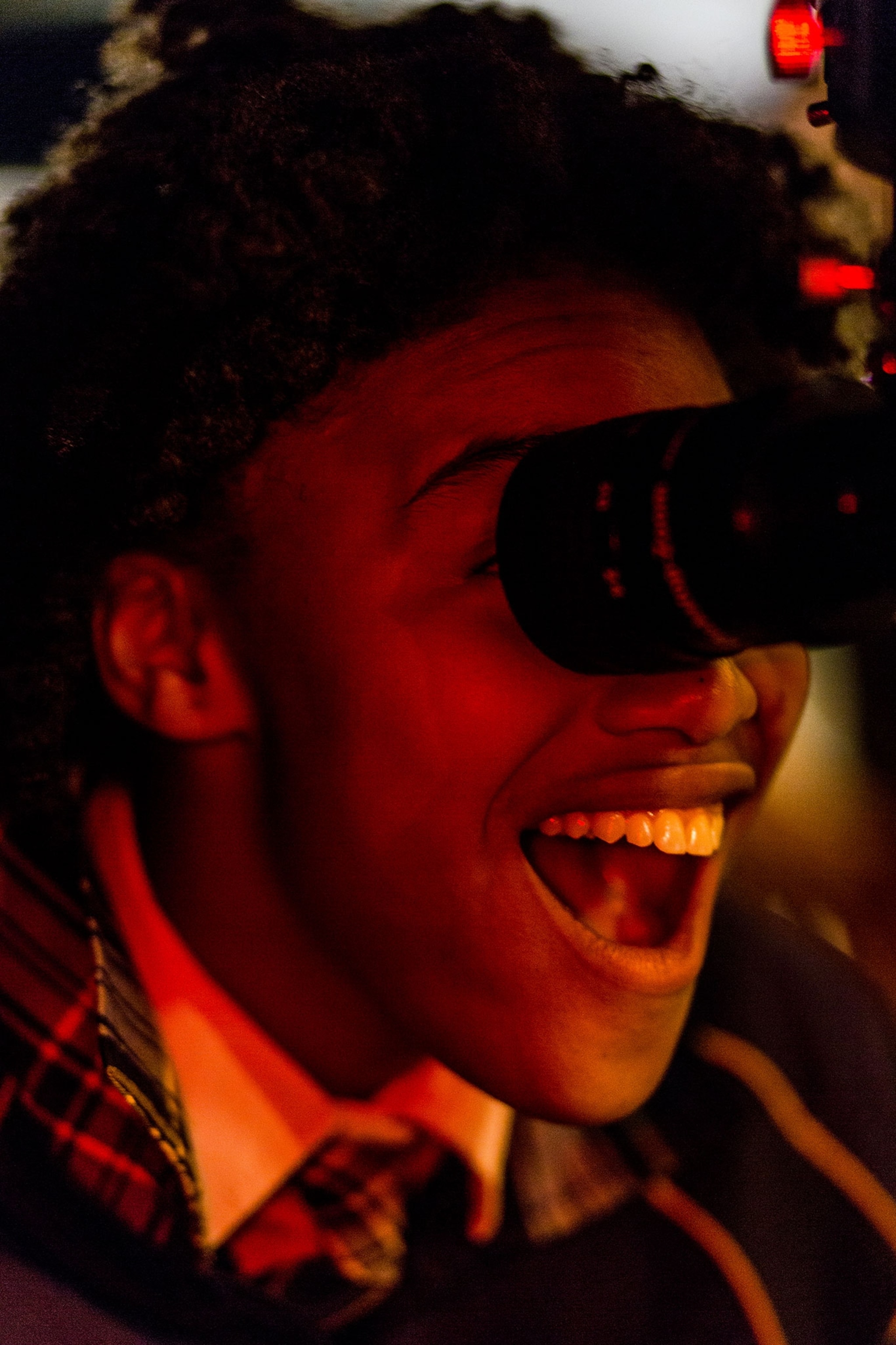 a young girl looking through a telescope.