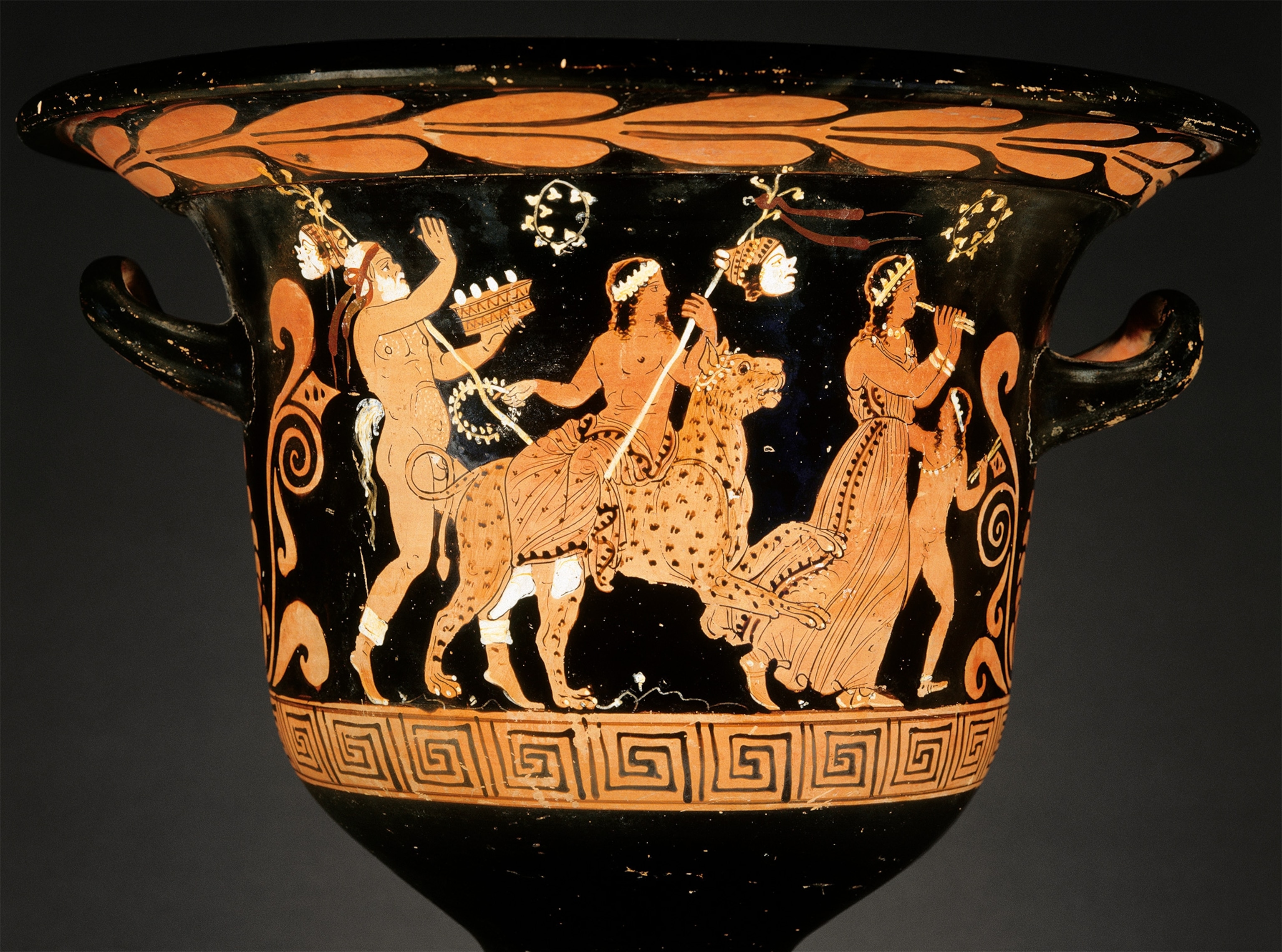 In an attic red-figure krater from 370 B.C., Dionysus is shown mounted on a leopard, presiding over a procession of faithful maenads and satyrs.
