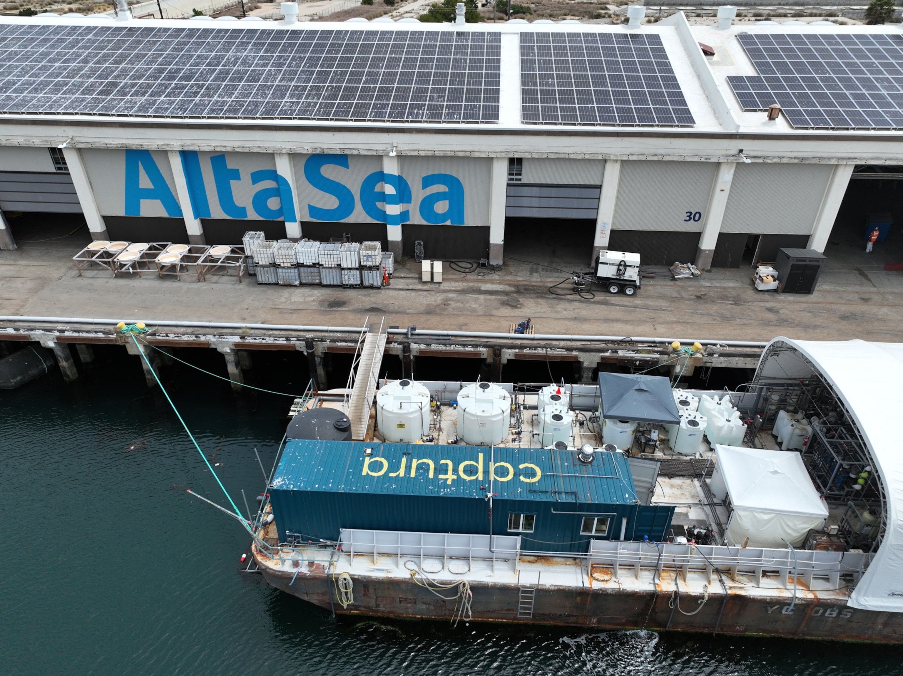 A large barge with monitoring equipment at a research facility