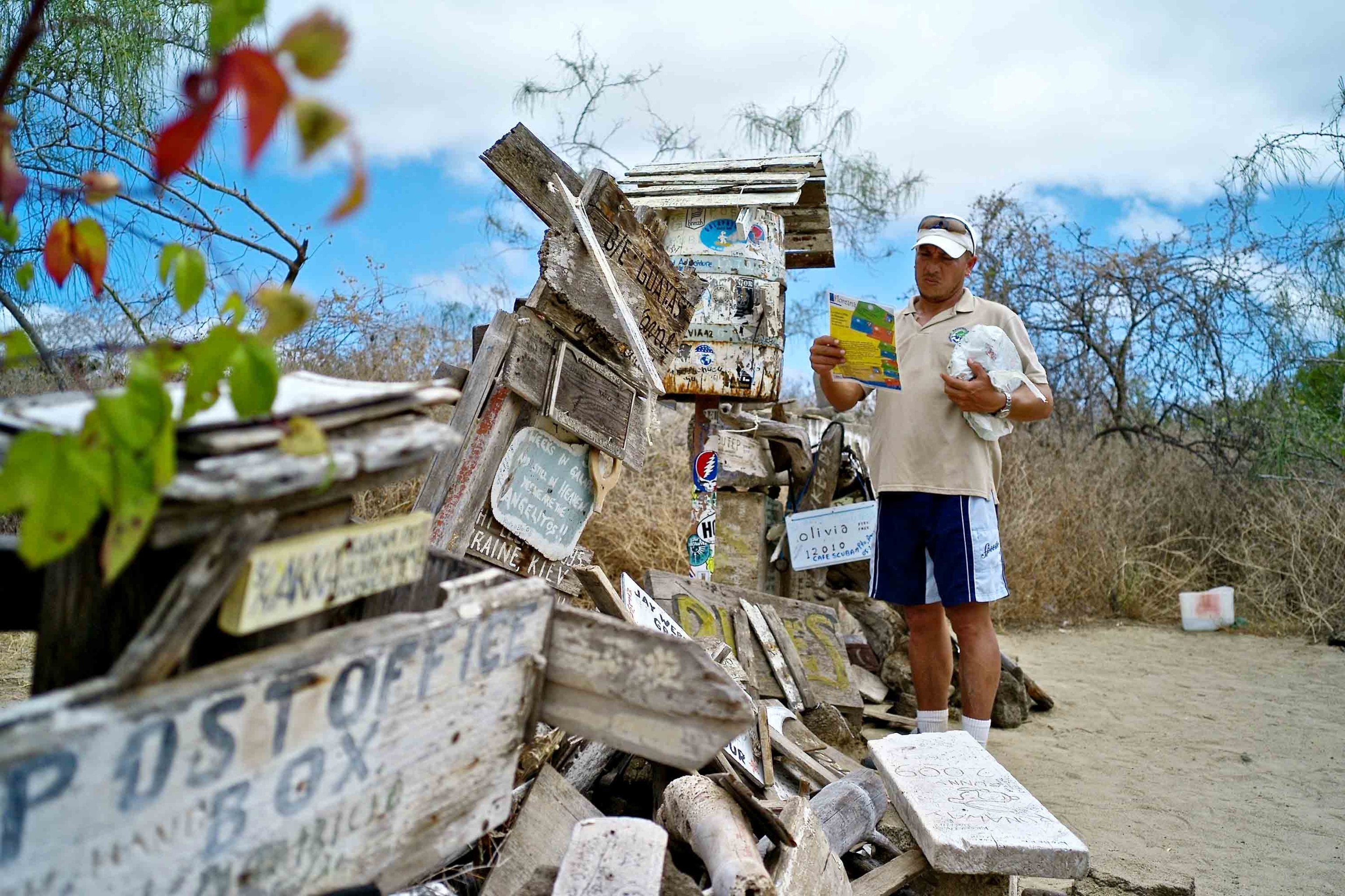 a tourist at Post Office Bay in the Galapagos